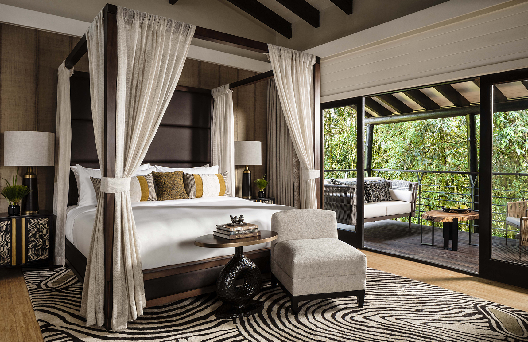 Africa, Rwanda, Nyungwe Forest National Park, One&Only Nyungwe House, suite bedroom with four poster bedand garden terrace