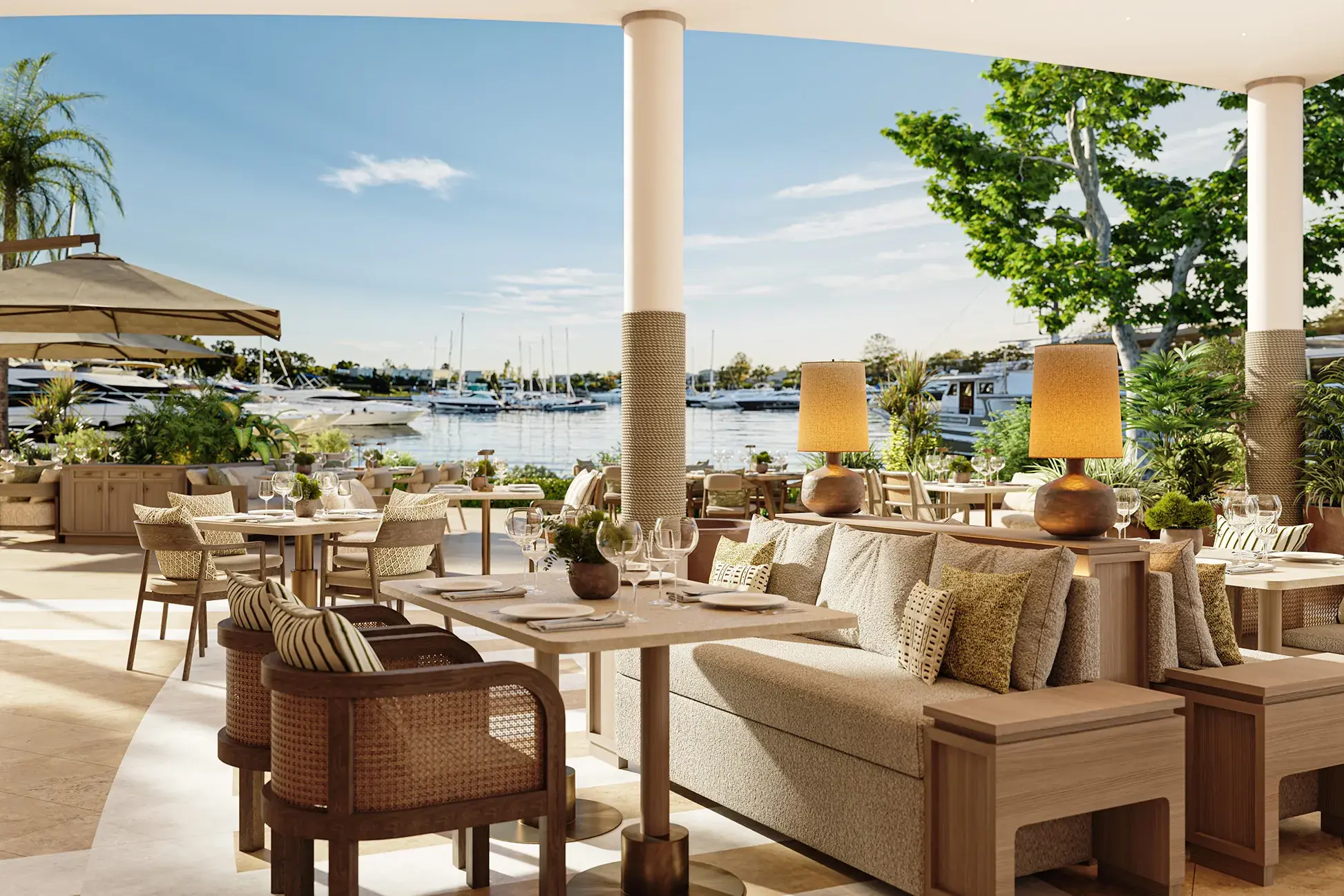 The elegant WATER Restaurant at Sani Asterias in Halkidiki with marina views, natural décor and sunlit outdoor dining.