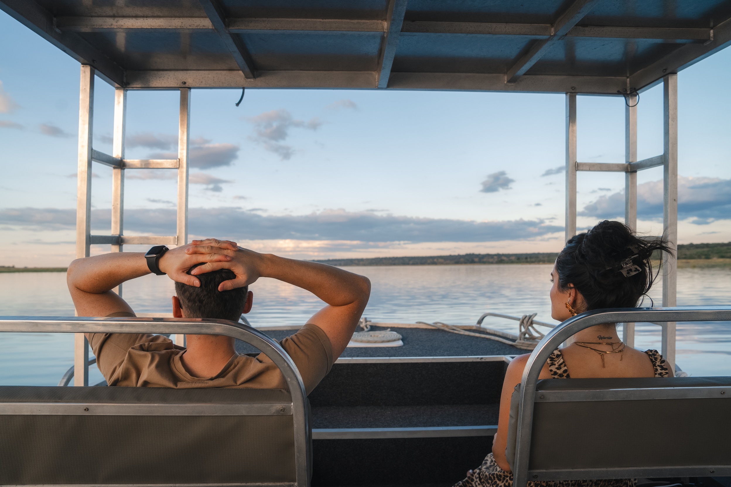 Guests enjoying a sunset cruise along the Chobe River aboard the Chobe Princess