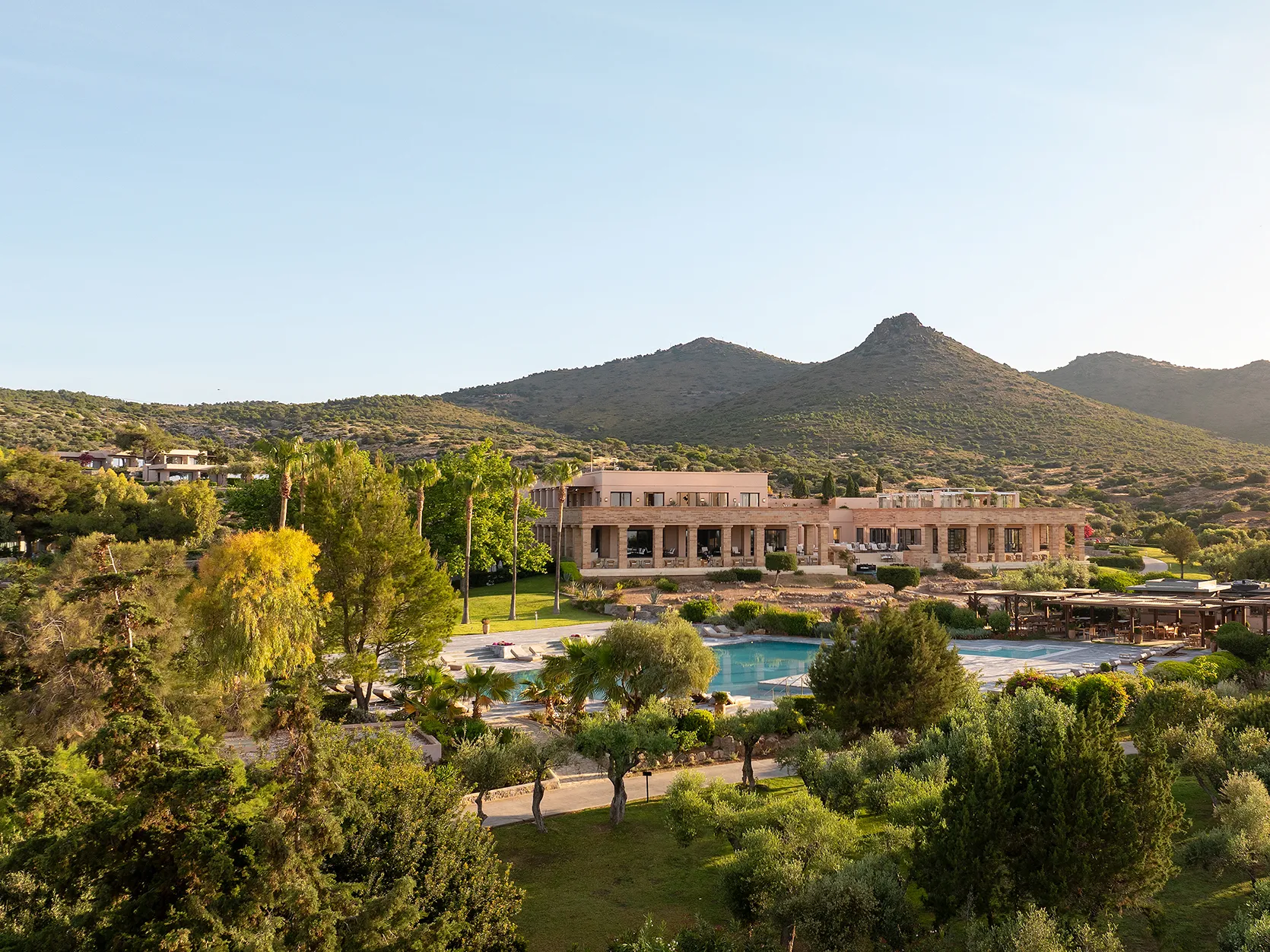 Europe, Greece, Athens Riviera, Cape Sounio, view of the hotel and pool shrouded in greenery