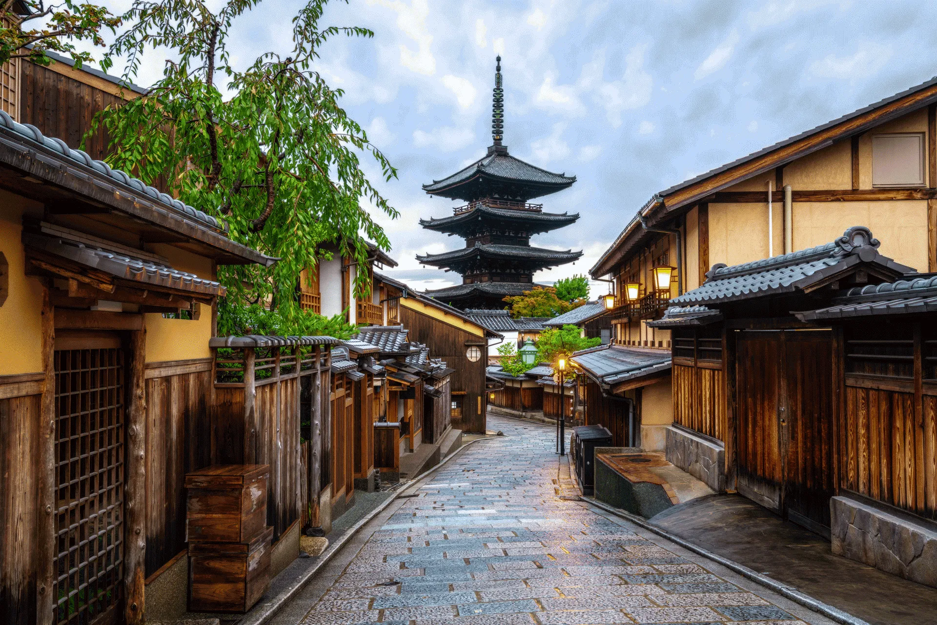 A traditional street in Japan with a temple in view at the far end