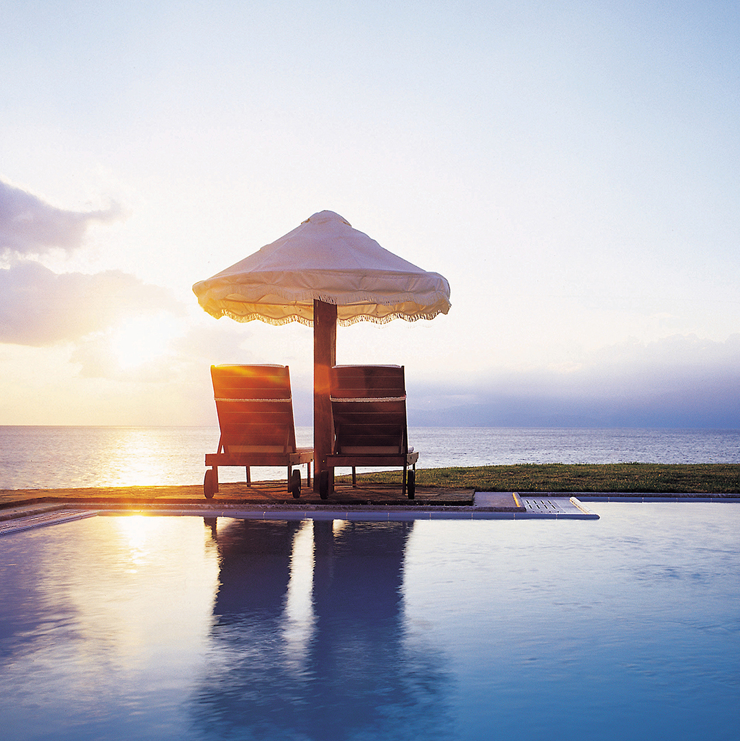 Europe, Greece, Crete, Elounda Peninsula All Suite Hotel, Loungers by the sea