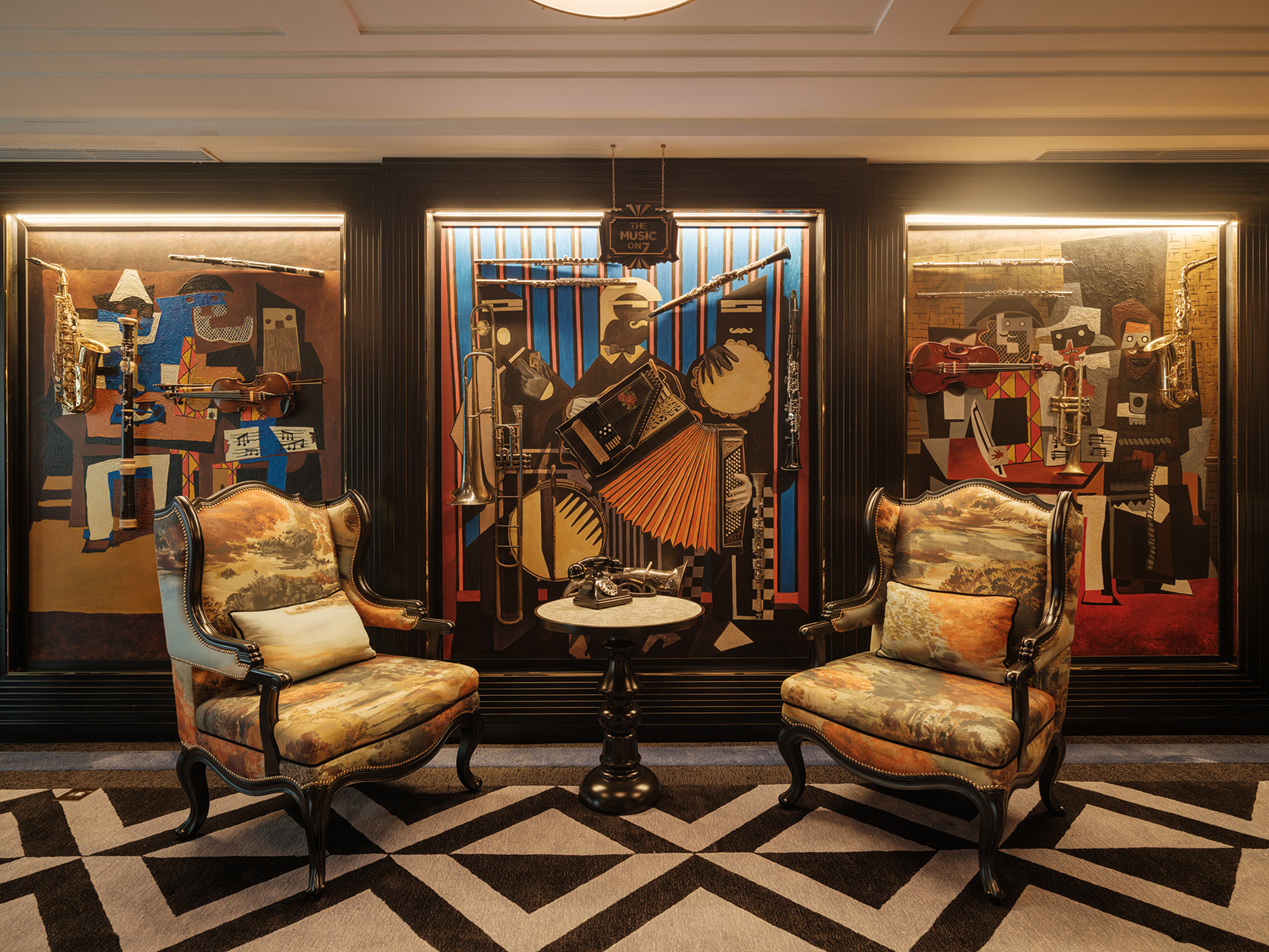 Asia, Vietnam, Hanoi, Capella Hanoi, lobby on guest floor, two armchairs beside abstarct artwork