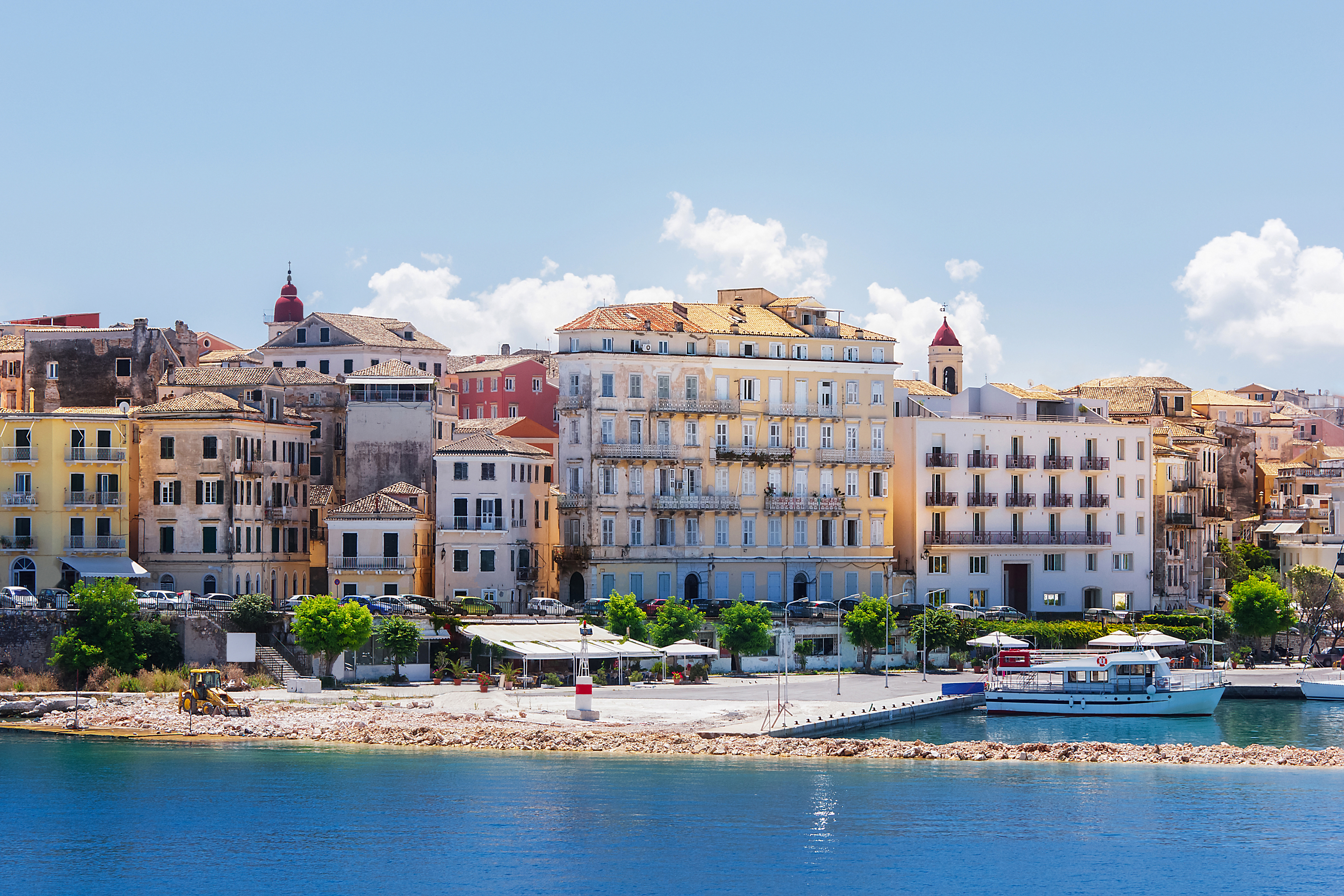 Corfu town from the water with boat anchored in harbour