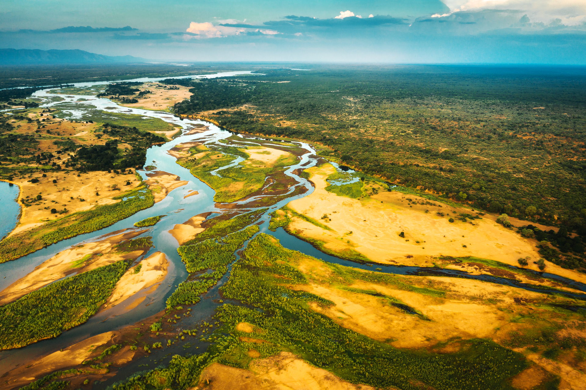 An aerial view of a river delta and fields
