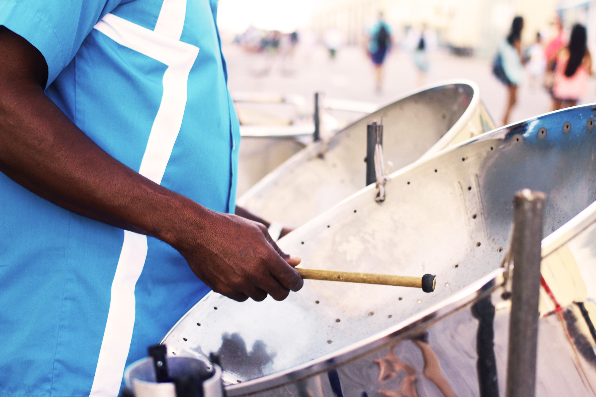 A man playing the steel drum instrument