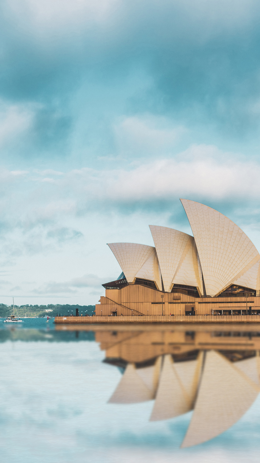 Sydney Opera House with a reflection of it in the surrounding water