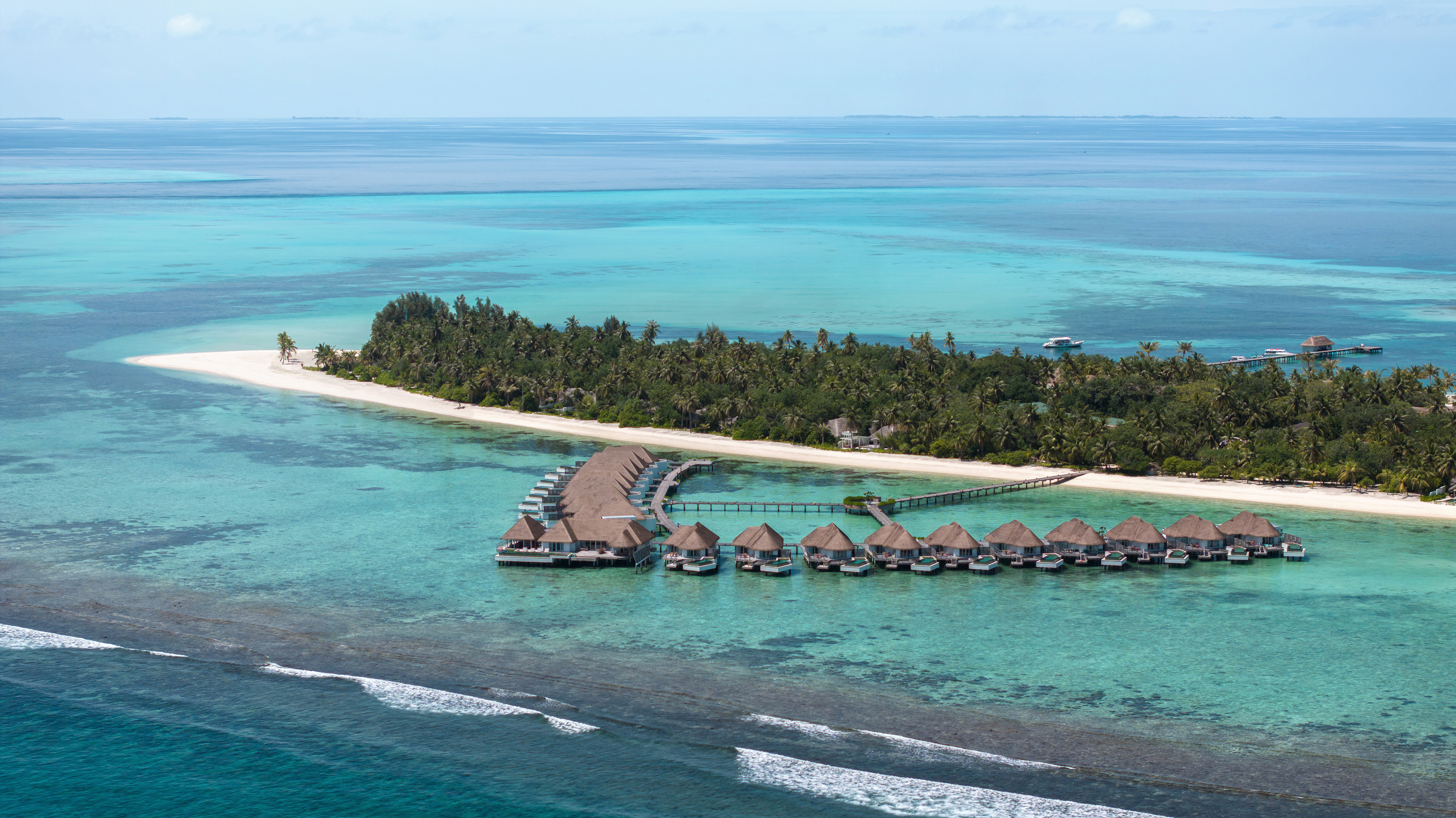 Aerial of the overwater villas jutting out into the ocean at Six Senses Kanuhura