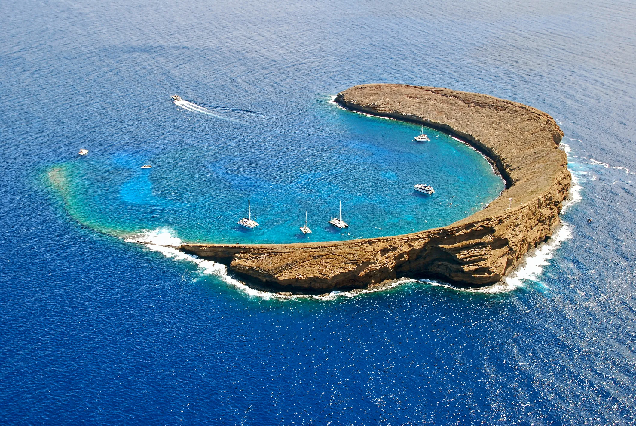 Aerial view of Molokini Crater surrounded by turquoise waters, Maui, Hawaii