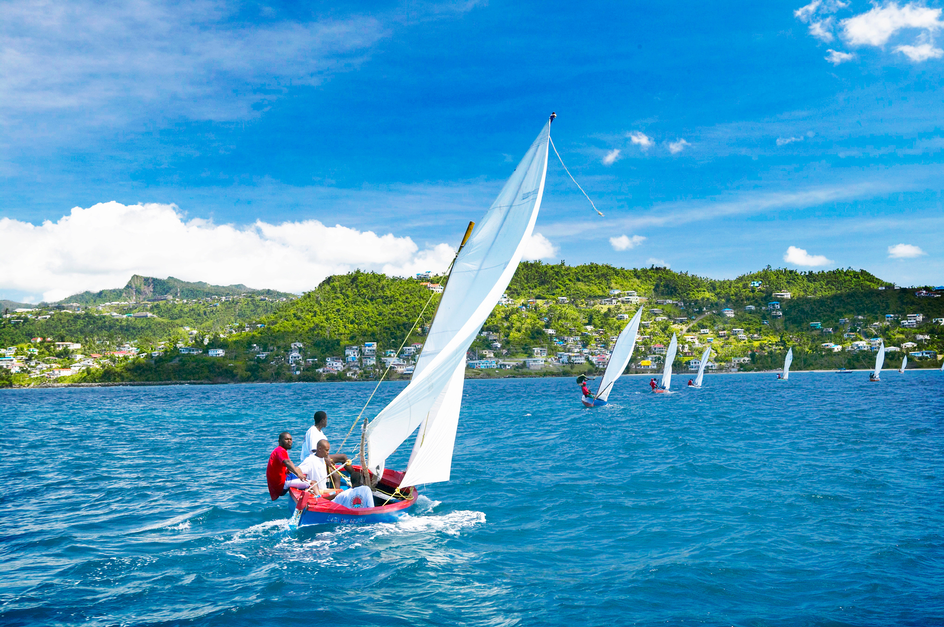 Small sailing boats sailing off the coast of grenada