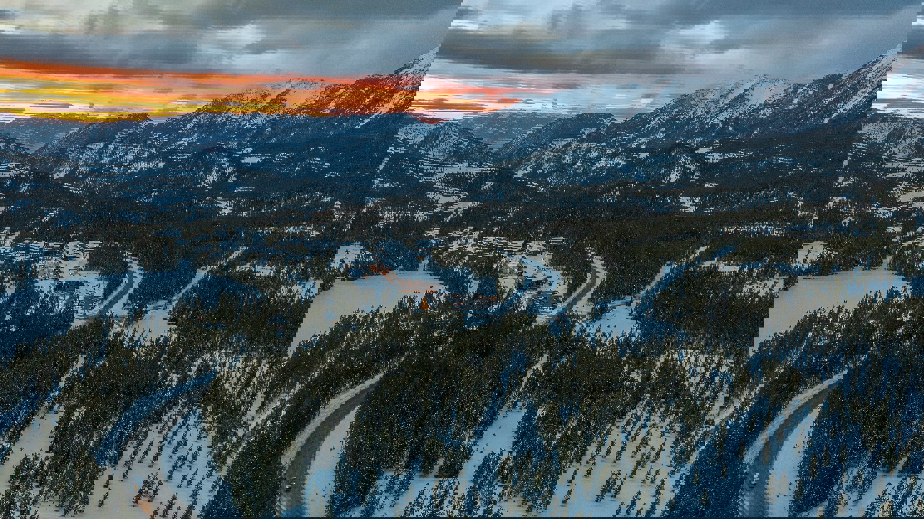 A vast snowy landscape at sunset in Big Sky Ski Resort, Montana