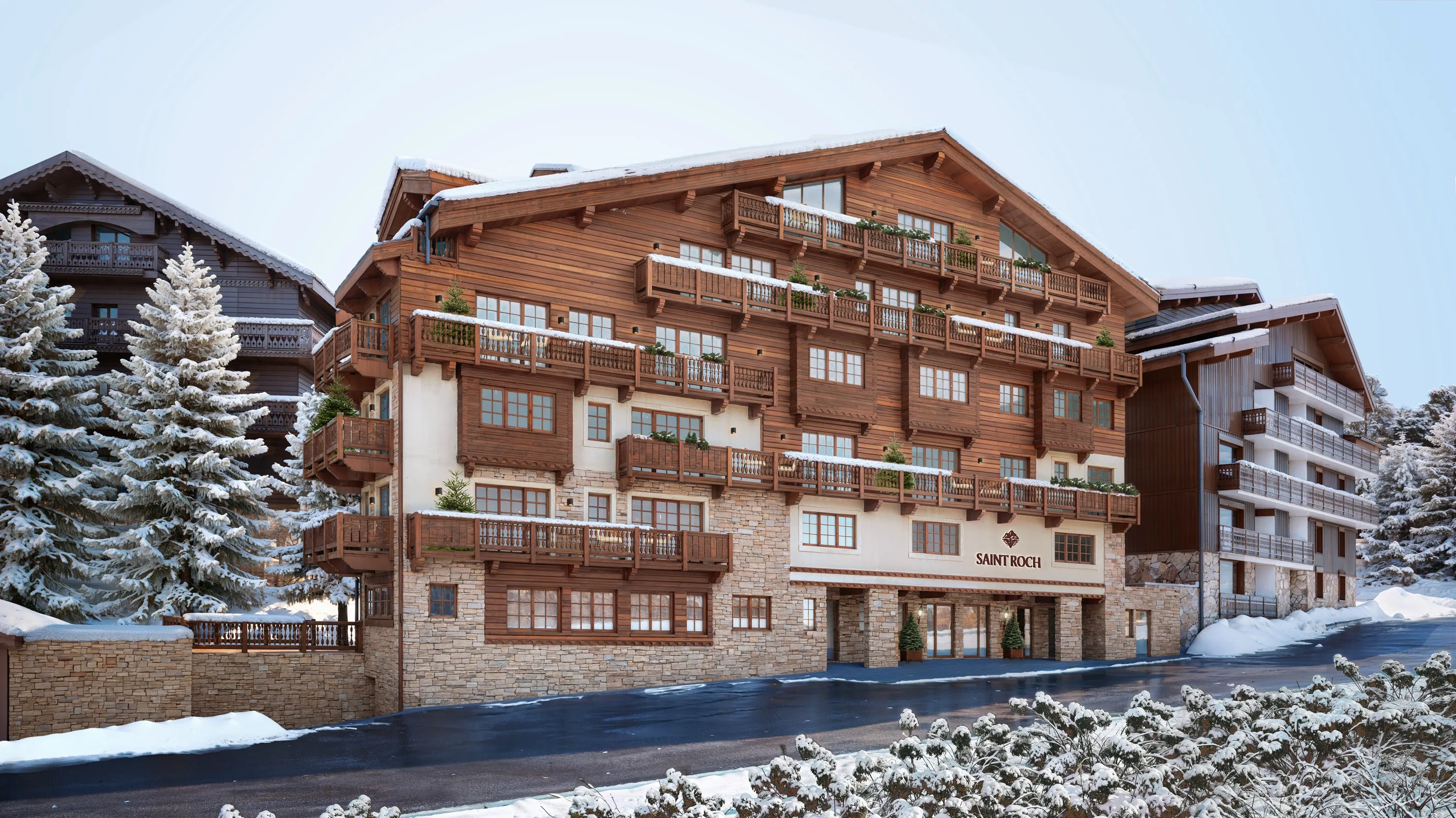 Snow-covered exterior of Saint Roch luxury hotel in Courchevel 1850