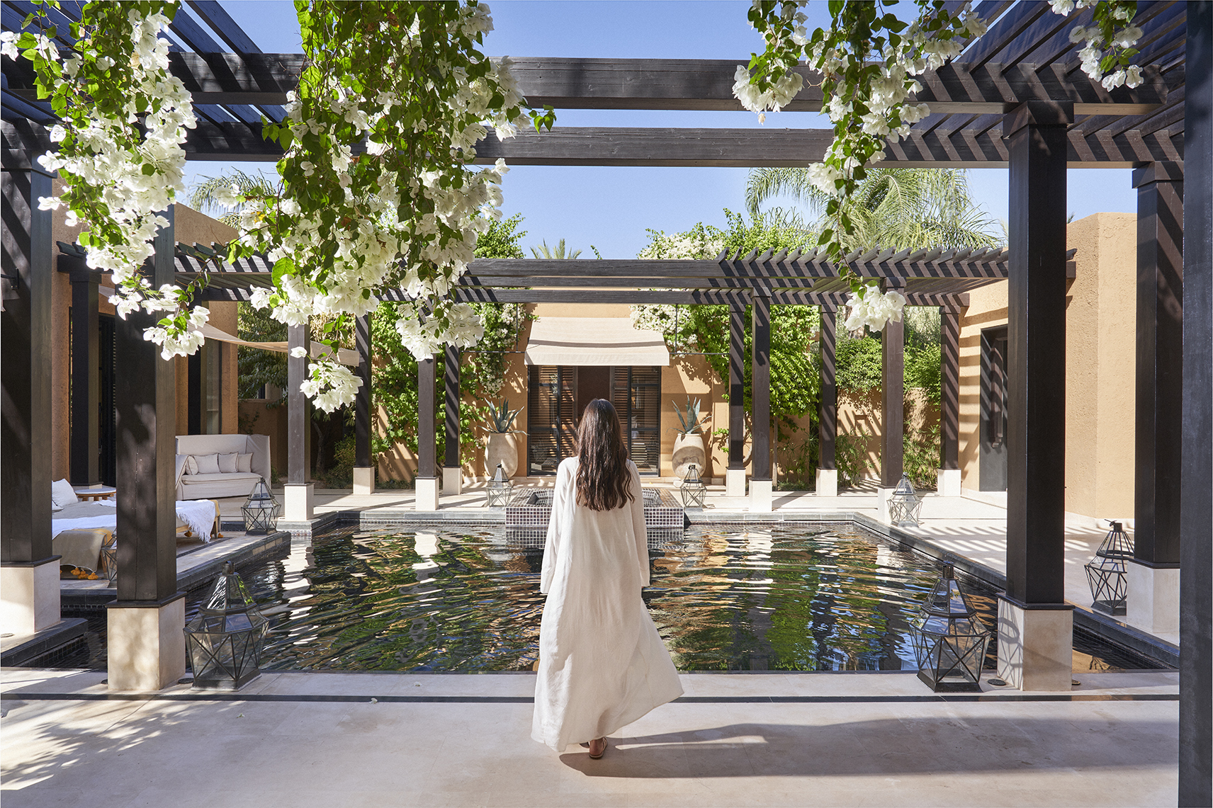 Africa, Morocco, Mandarin Oriental Marrakech, woman stood in front of a pool villa pool