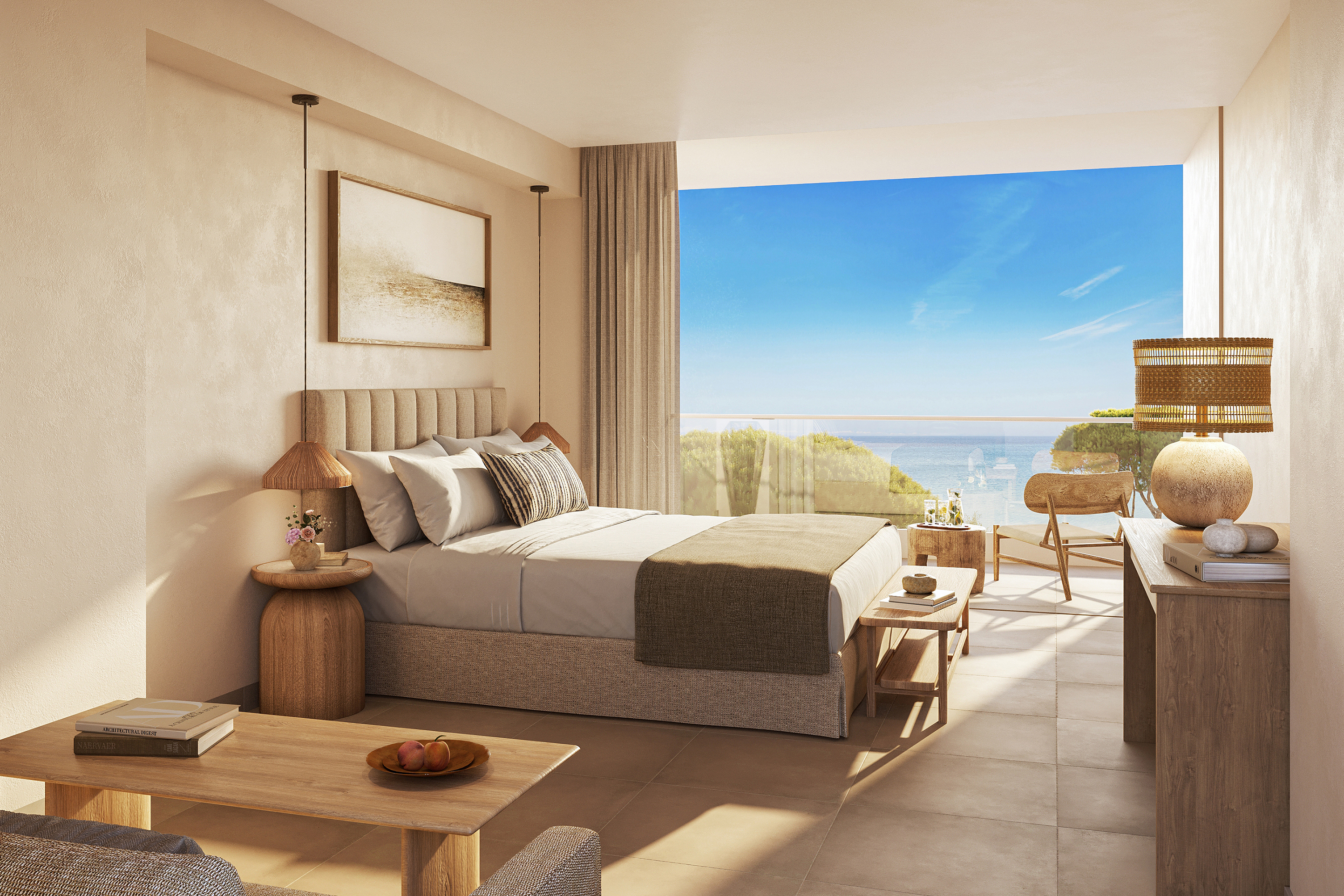 A stylish room decorated in neutral tones featuring a plush bed and wooden furniture with large windows looking out to sea