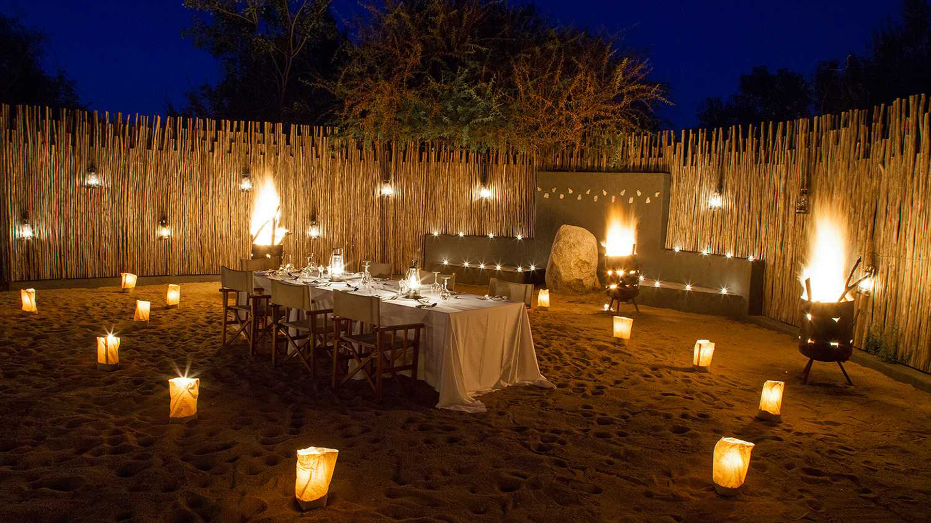  Africa, South Africa, Londolozi Private Granite Suites, Outdoor dining at night