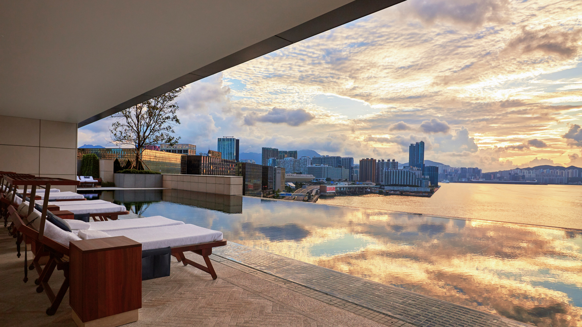 Roswood Hong Kong loungers by a high rise infinity pool