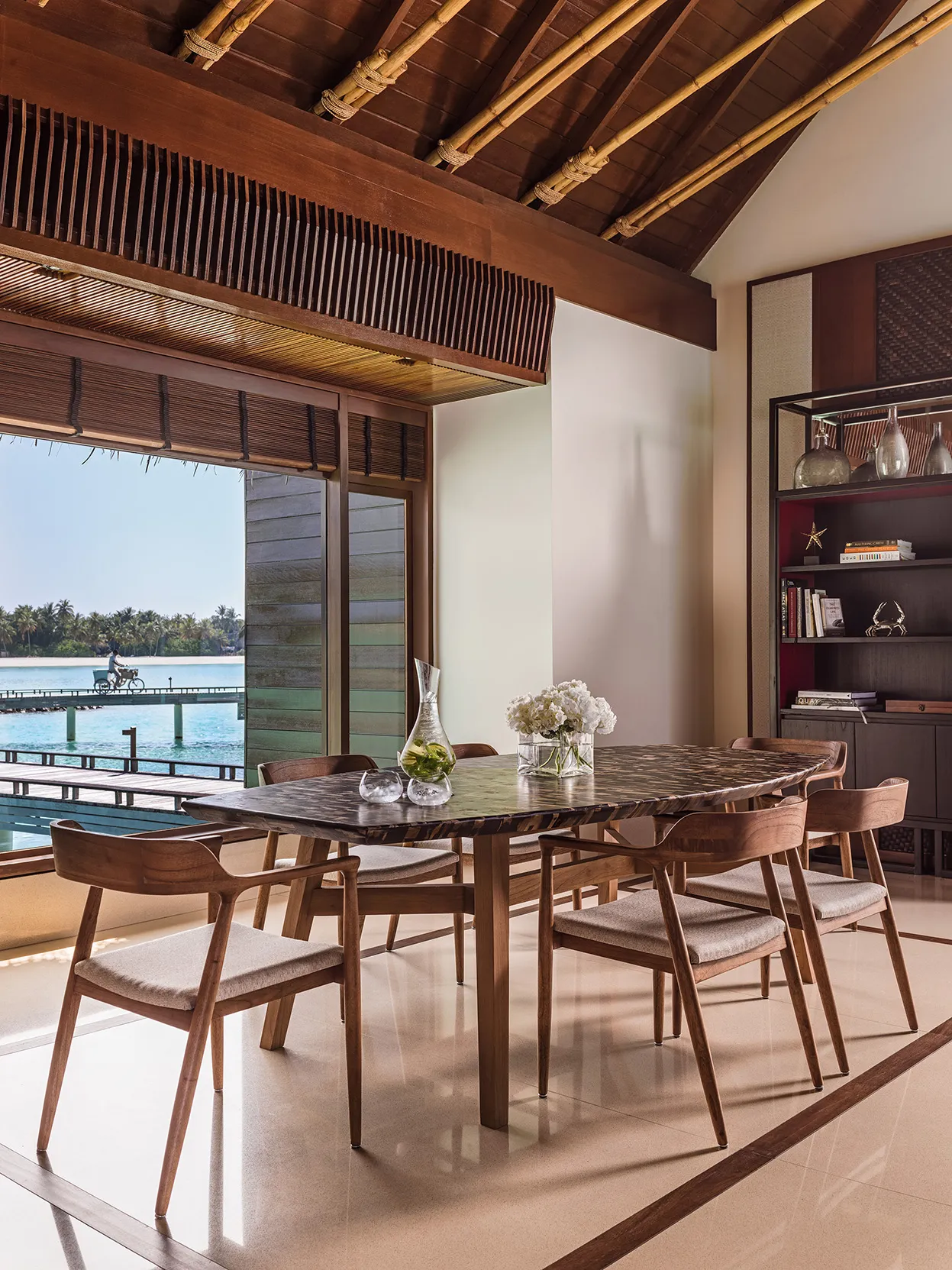 Dining area in a Grand Water Villa at One&Only Reethi Rah, Maldives 