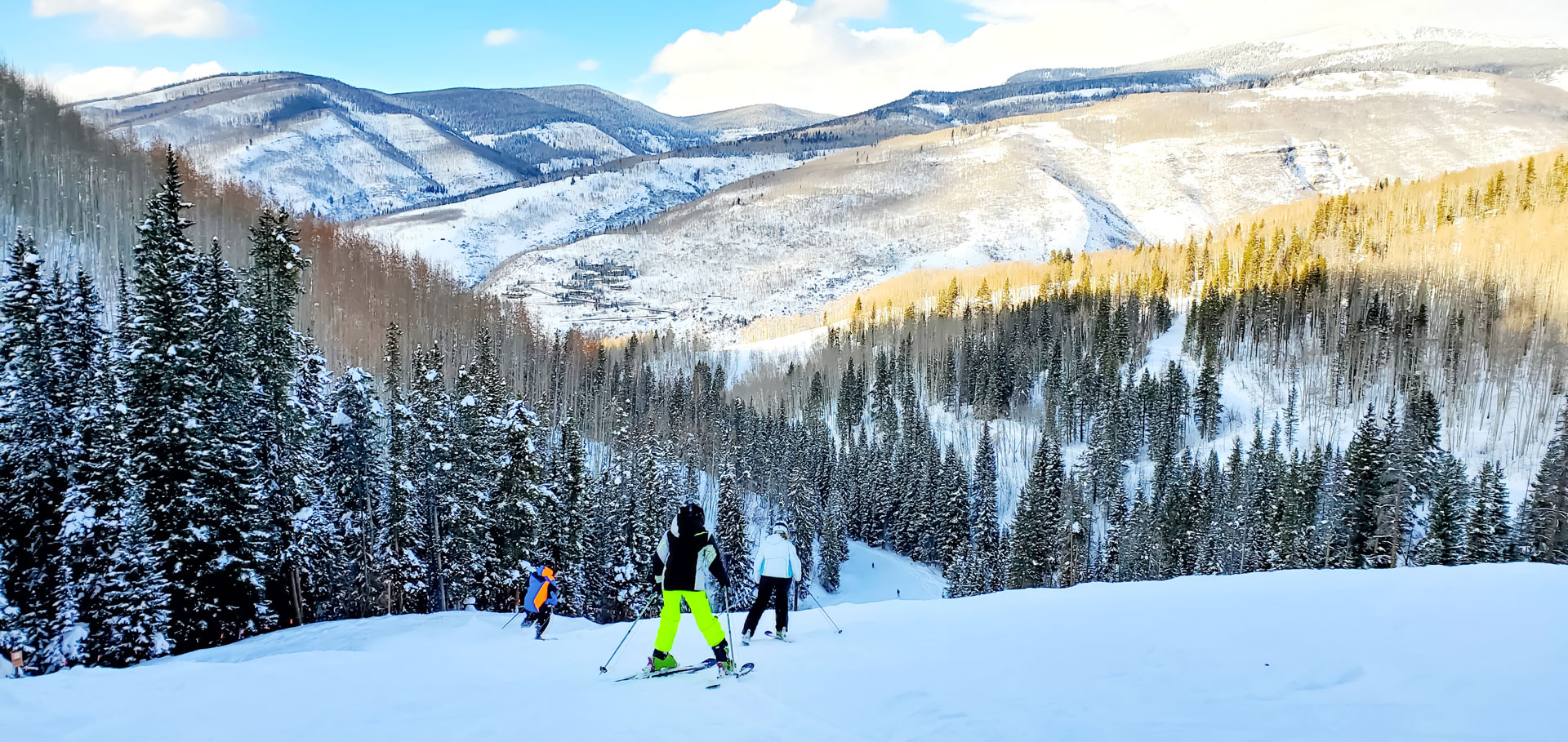 People skiing Skiing Riva Ridge heading towards a snowy forest