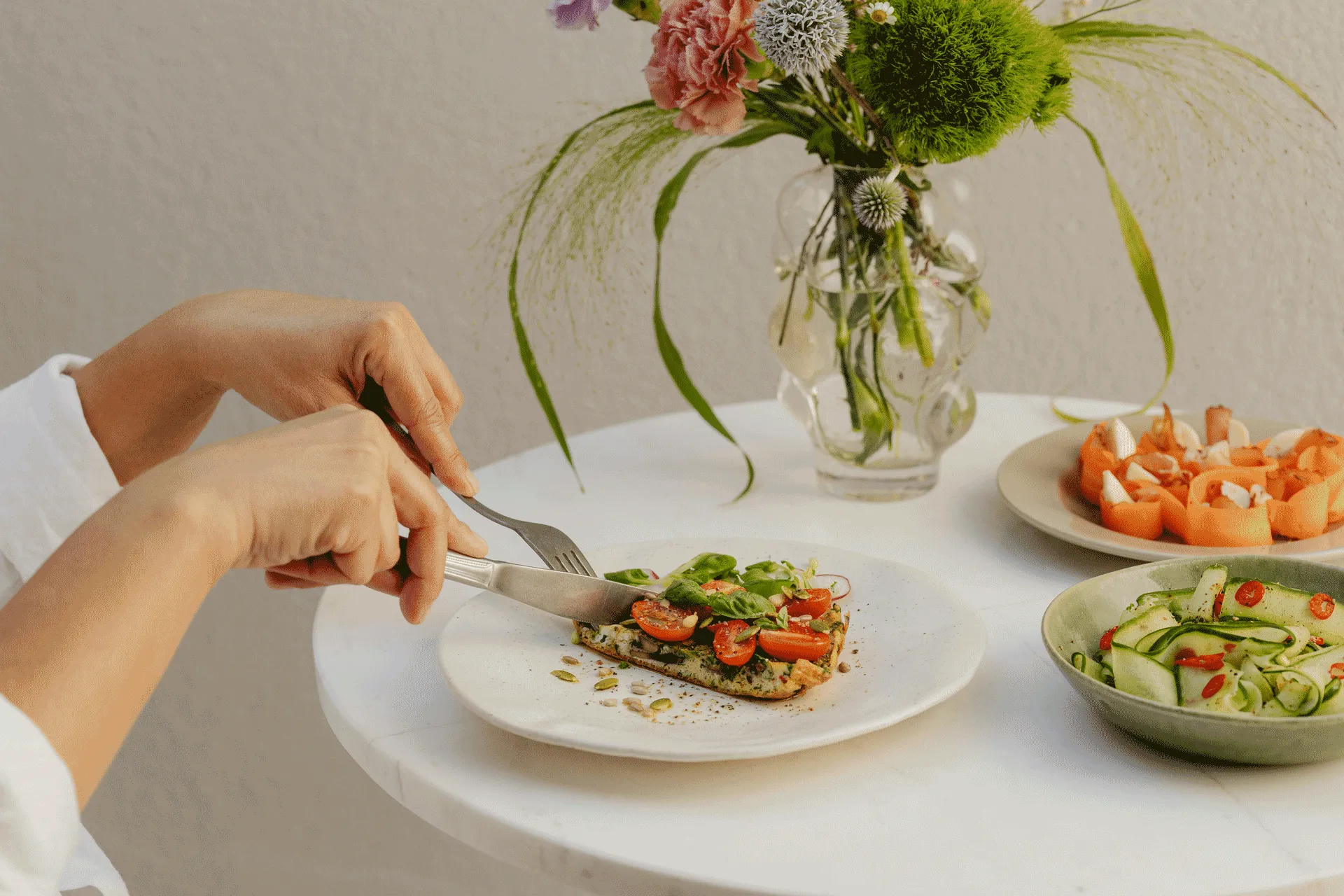 Healthy meal at Buff Medical Resort featuring fresh vegetables and light, nutritious dishes on a minimalist table setting.