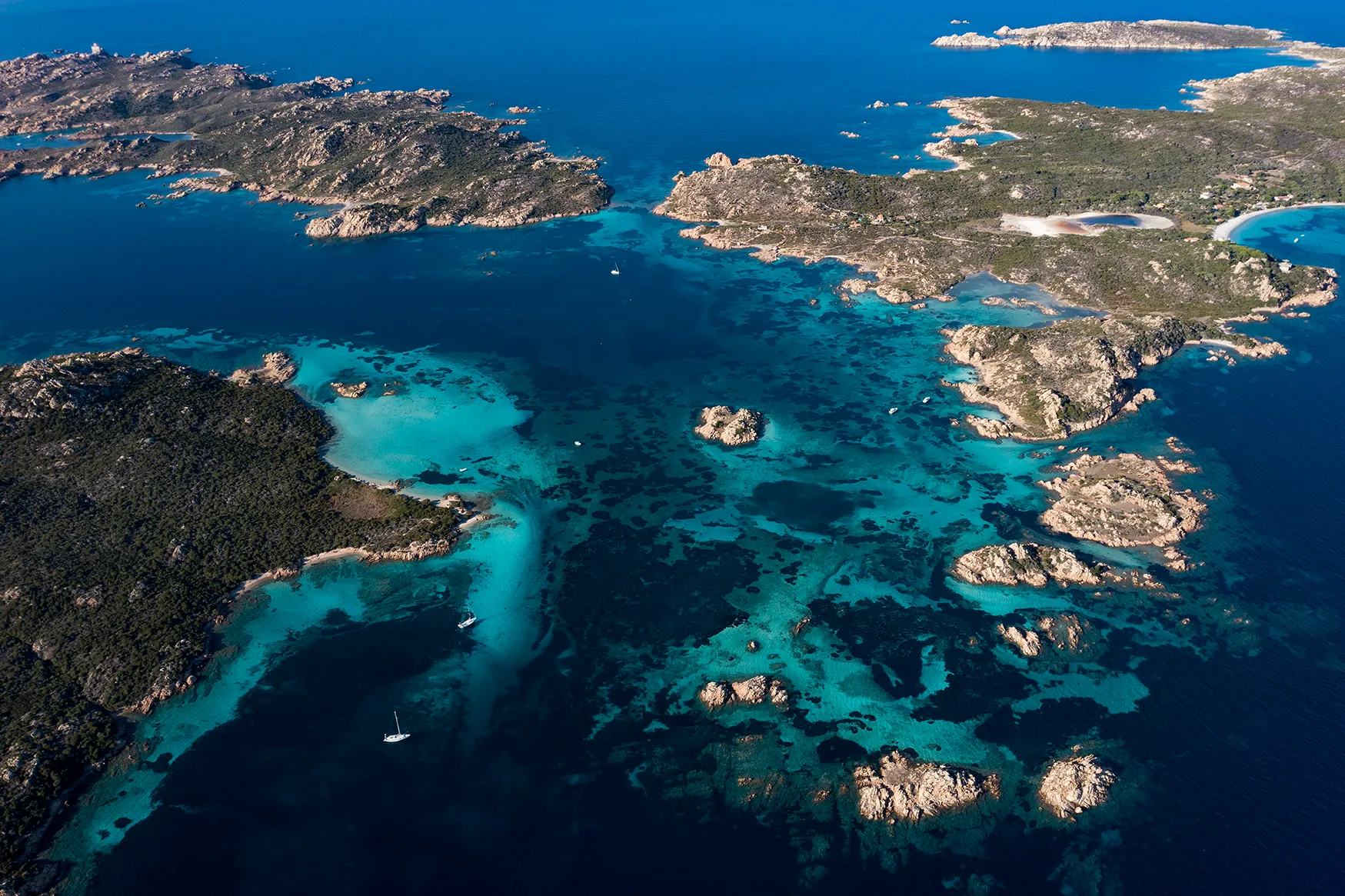 aerial view of La Maddalena archipelago with Budelli, Razzoli and Santa Maia islands bathed by a turquoise and clear waters. Sardinia, Italy.
