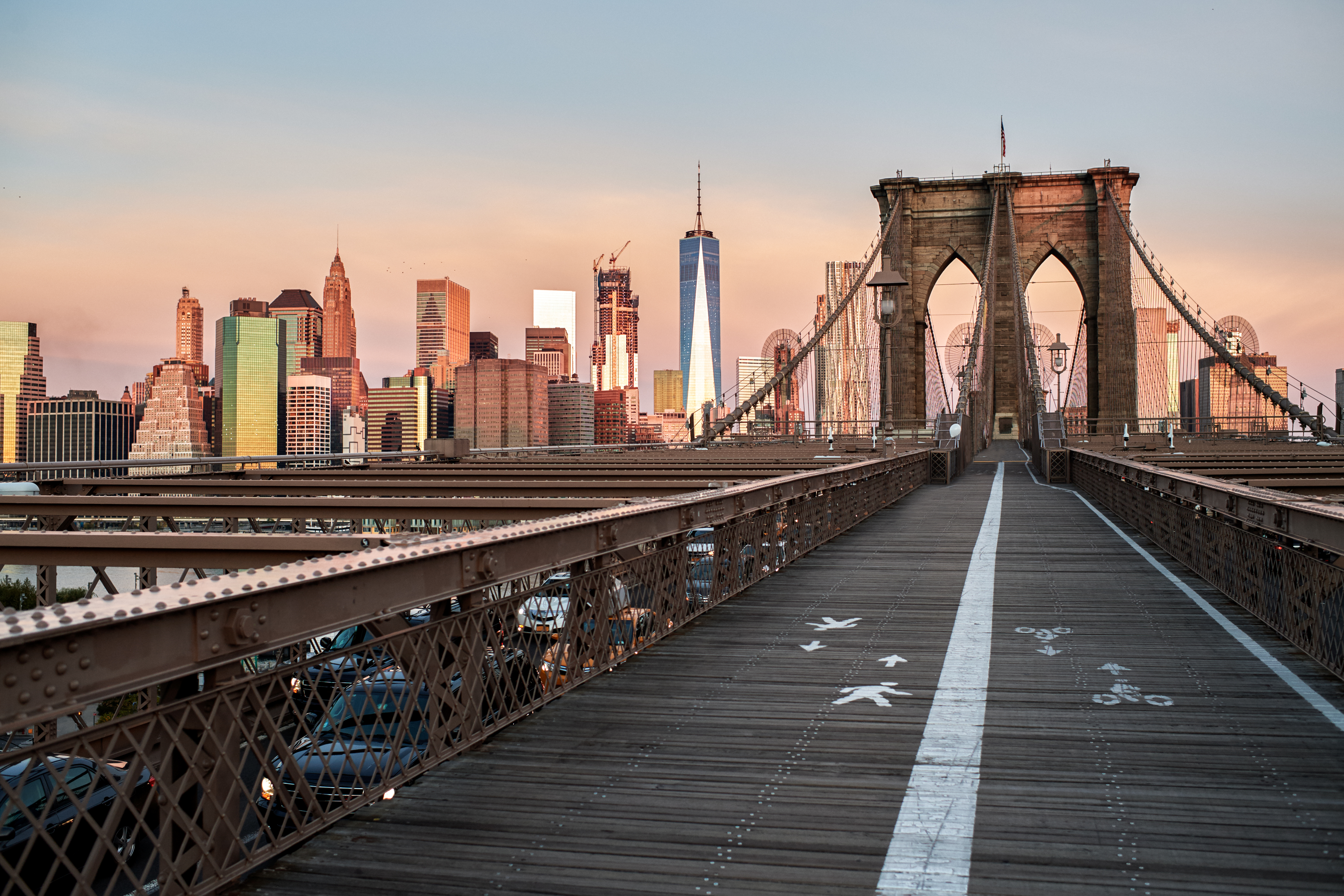 Brooklyn bridge walkway in the afternoon. Urban skyline is in the background