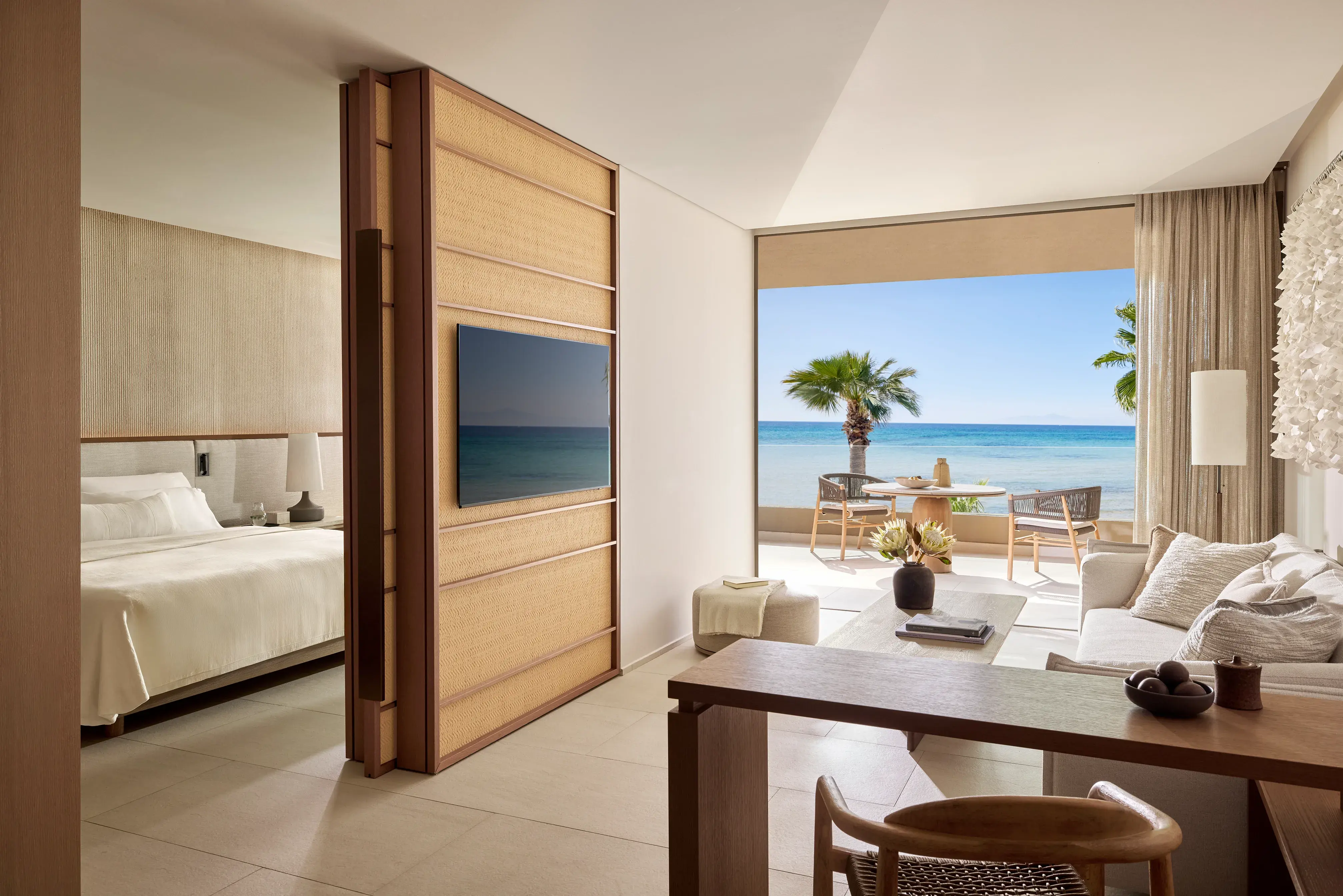 Beachfront luxury residence bedroom at Sani Asterias in Halkidiki with elegant interior design and a private terrace overlooking the Aegean Sea.”