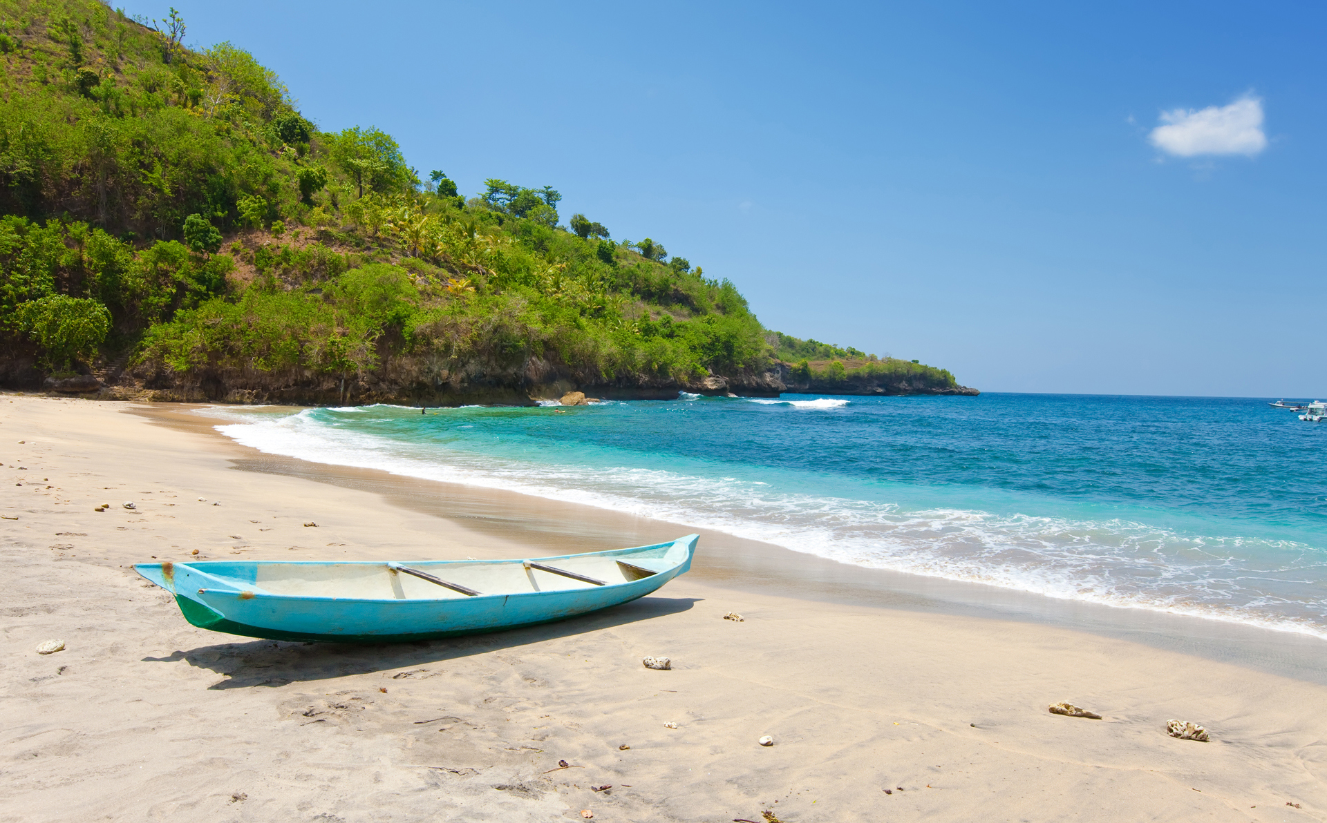A small empty boat on a beach