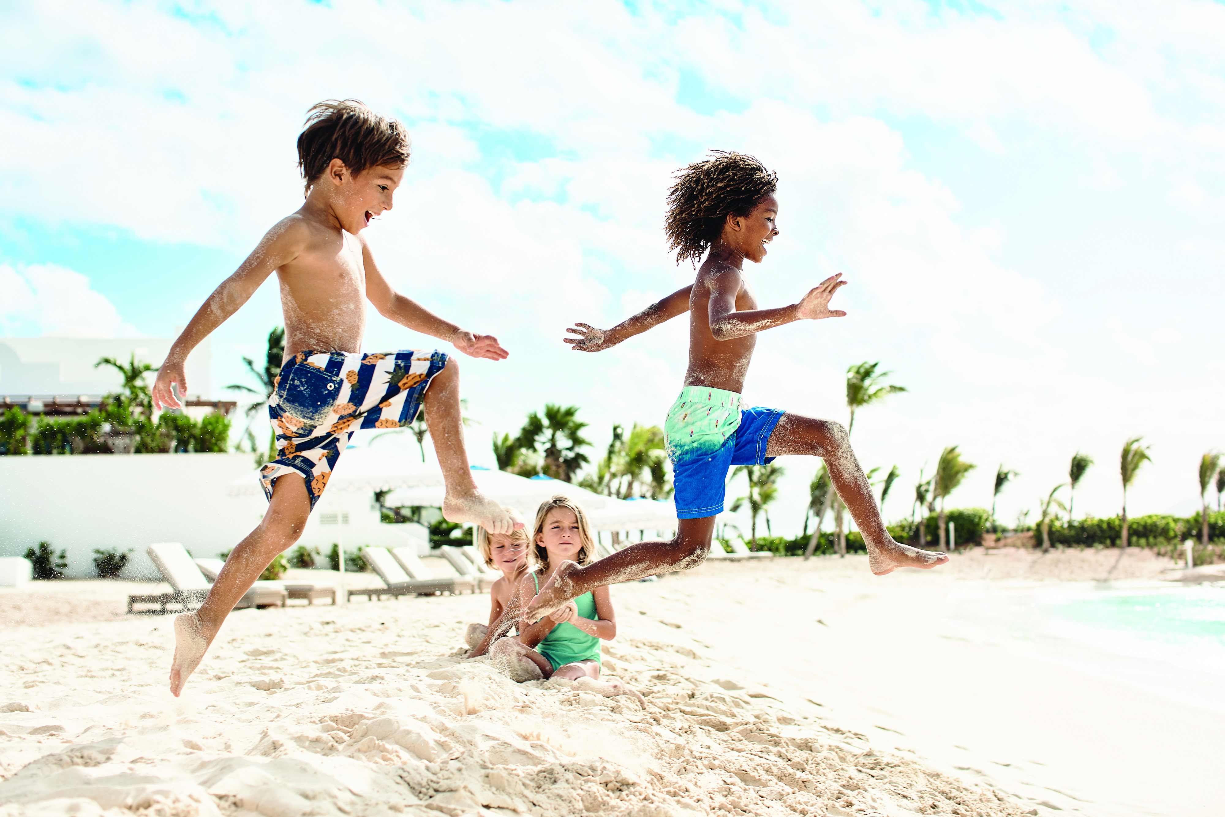 Children running on a sandy beach