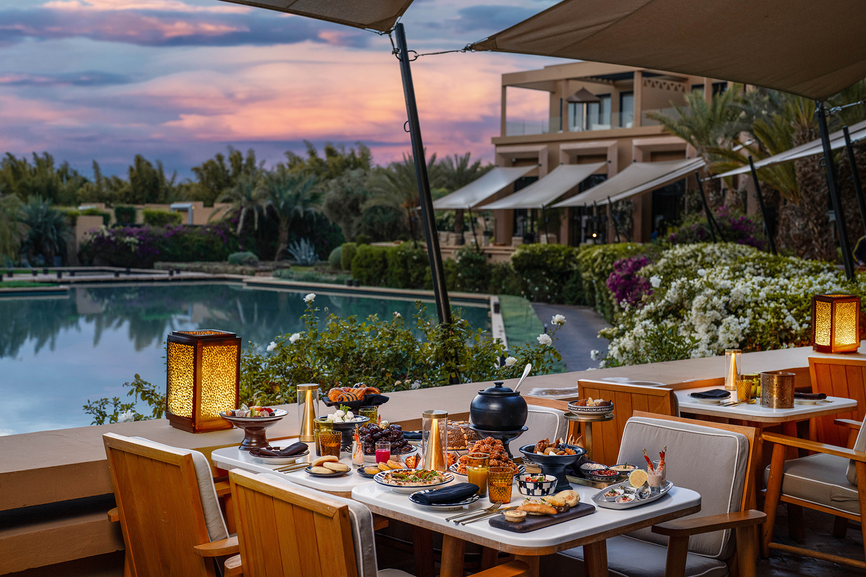 Africa, Morocco, Mandarin Oriental Marrakech, waterside dining table filled with food