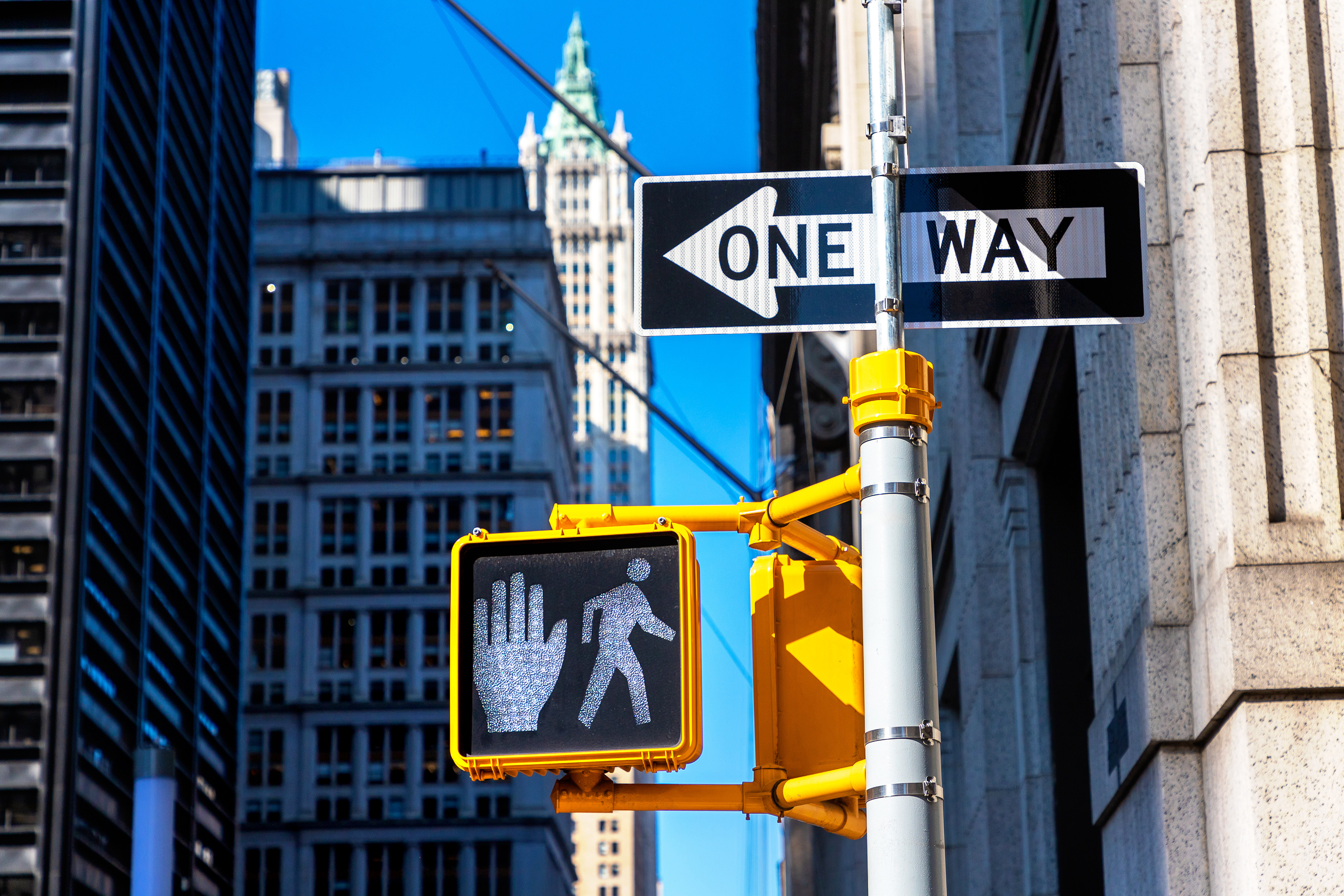 "Walk sign" traffic light and one way sign