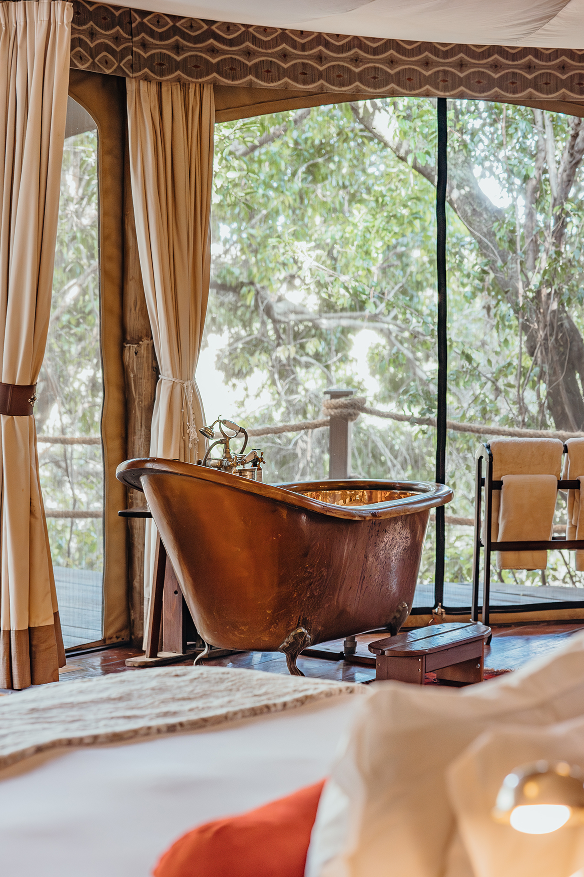 Africa, Kenya, Mara Plains Camp, free standing copper bath in bedroom 