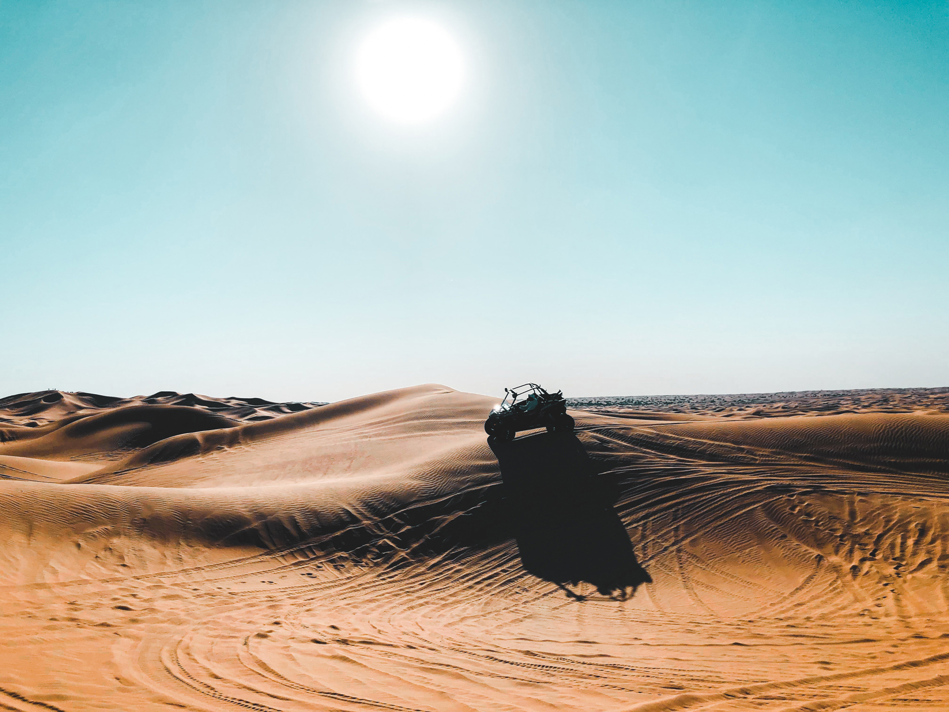 A buggy vehicle driving in the desert