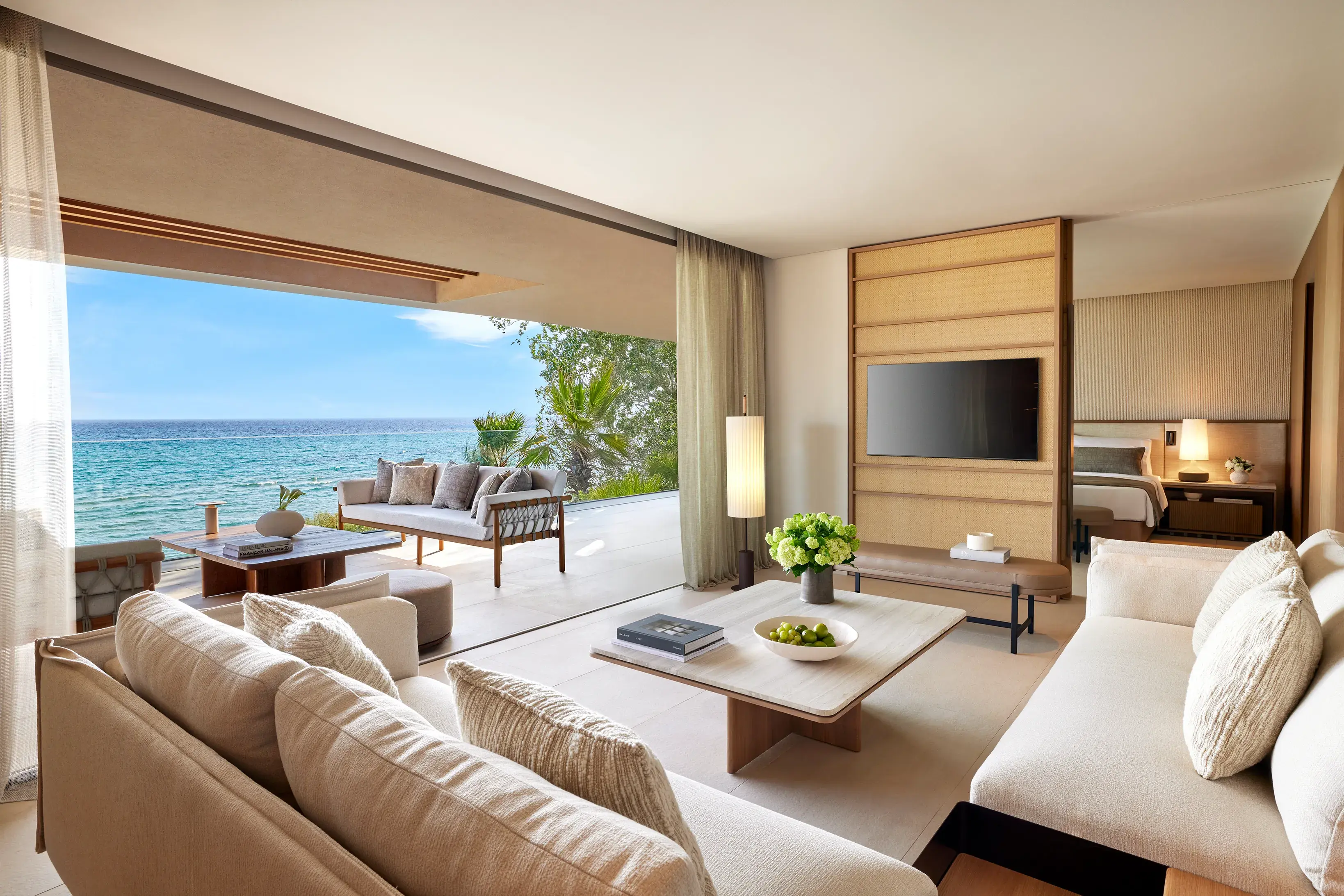 Elegant two bedroom grand residence on the beachfront at Sani Asterias in Halkidiki with spacious living area opening onto a terrace overlooking the Aegean Sea.