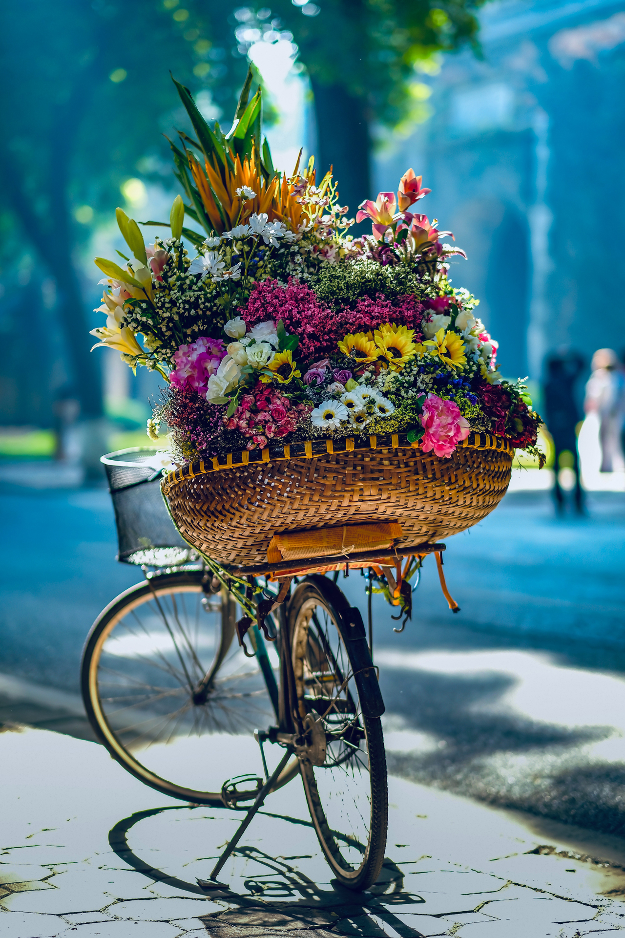 A large bouquet of flowers on a bicycle