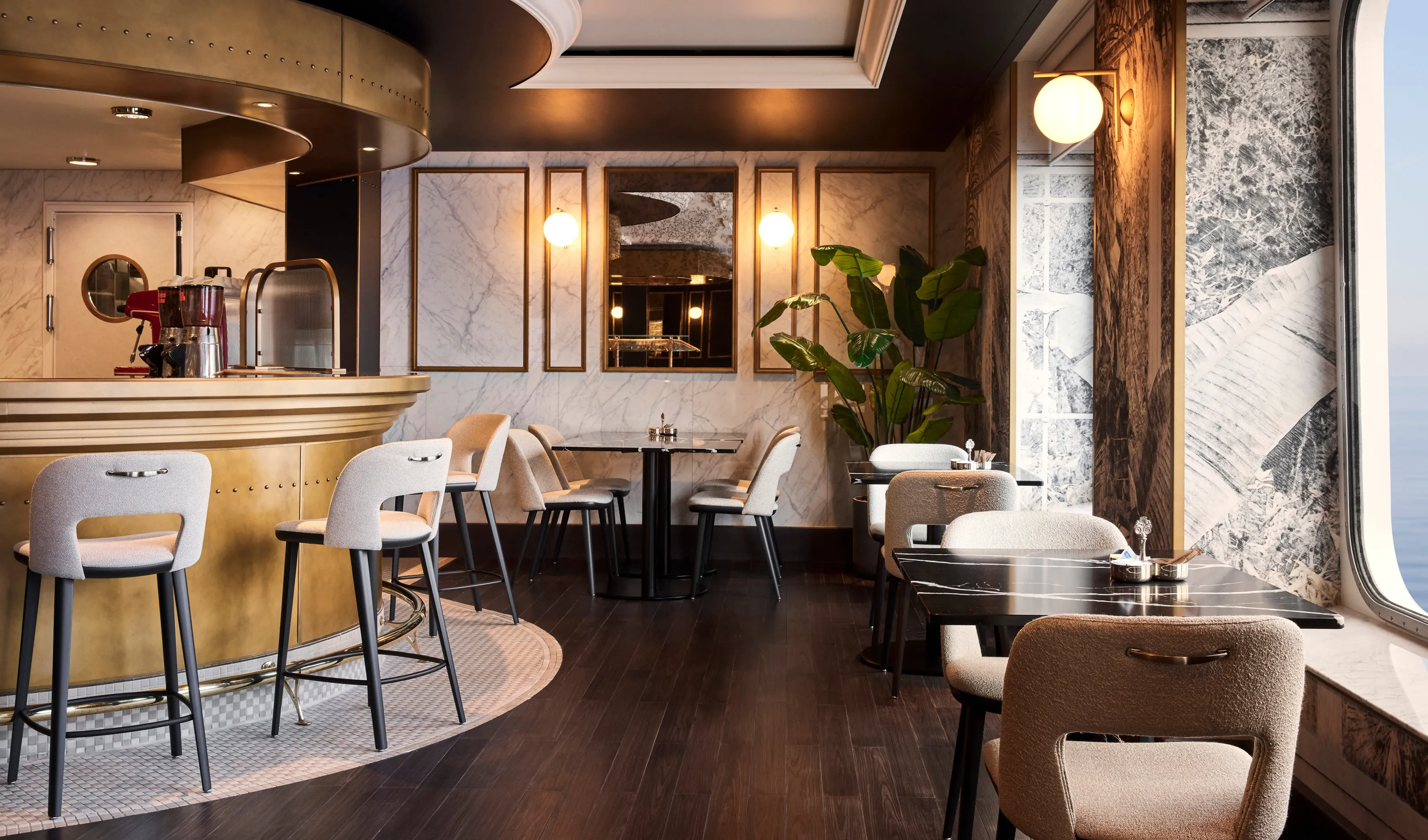 Chic Crystal cruise café with a curved bar, elegant seating, and large windows letting in natural light.