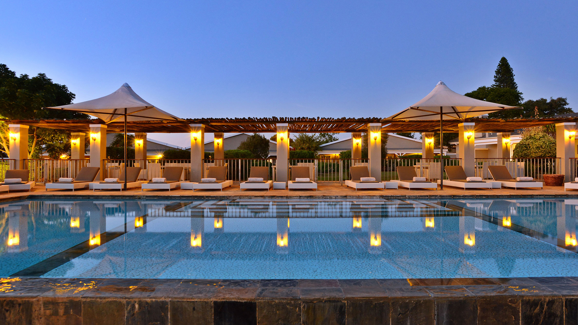 Africa, South Africa, Riverdene Family Lodge at Shamwari Private Game Reserve, Pool evening