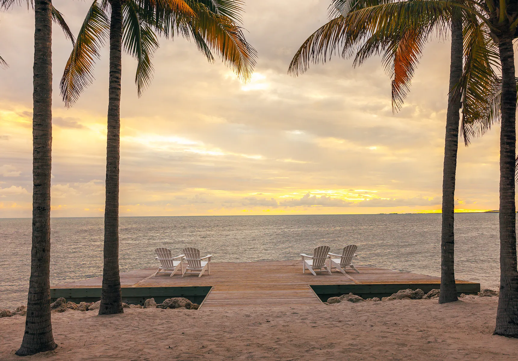 North America, USA, Florida, Isla Bella Beach Resort, four chairs at Pelican point sunset viewing platform