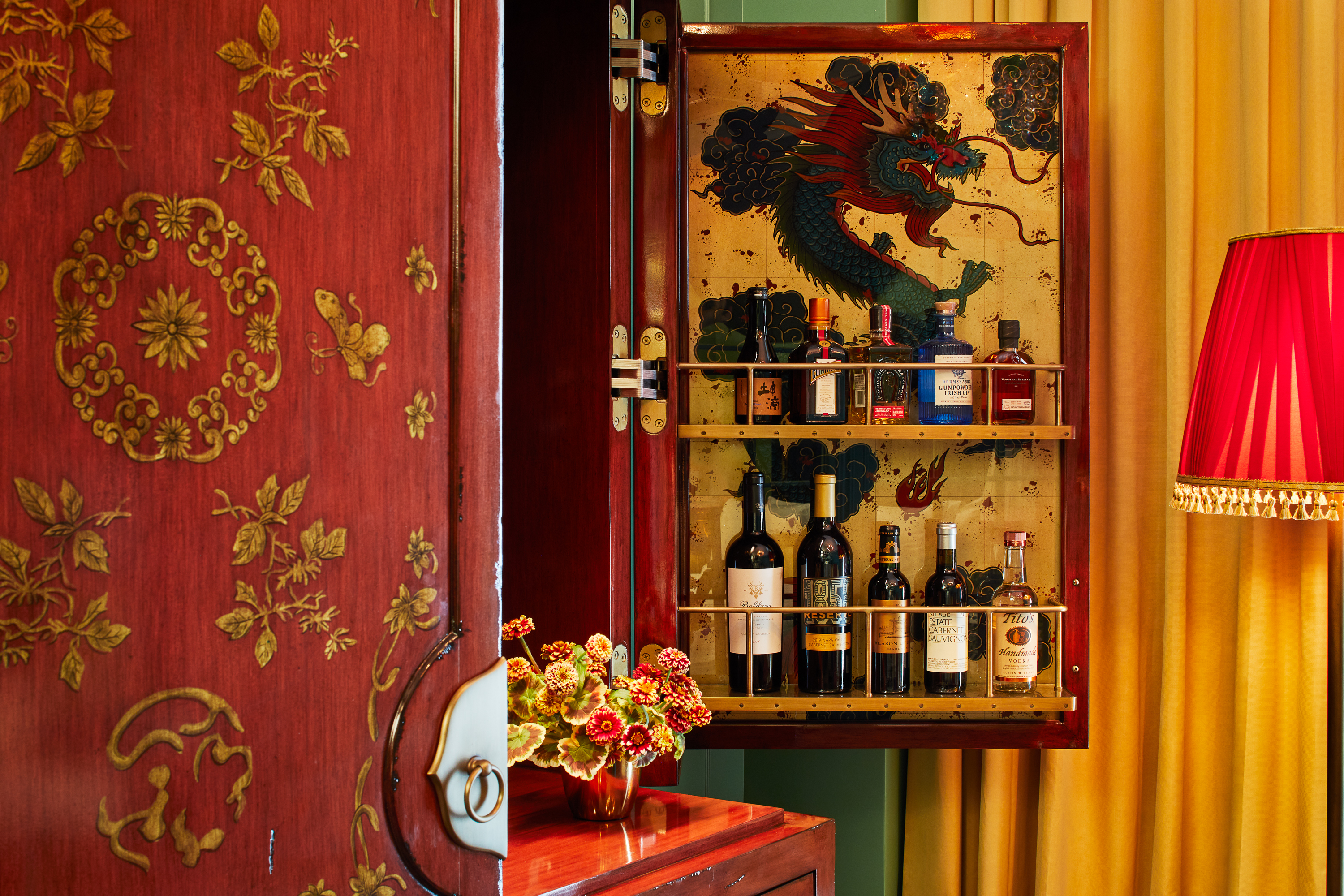 Ornate Chinese cabinet turned into a mini bar at Fifth Avenue Hotel New York