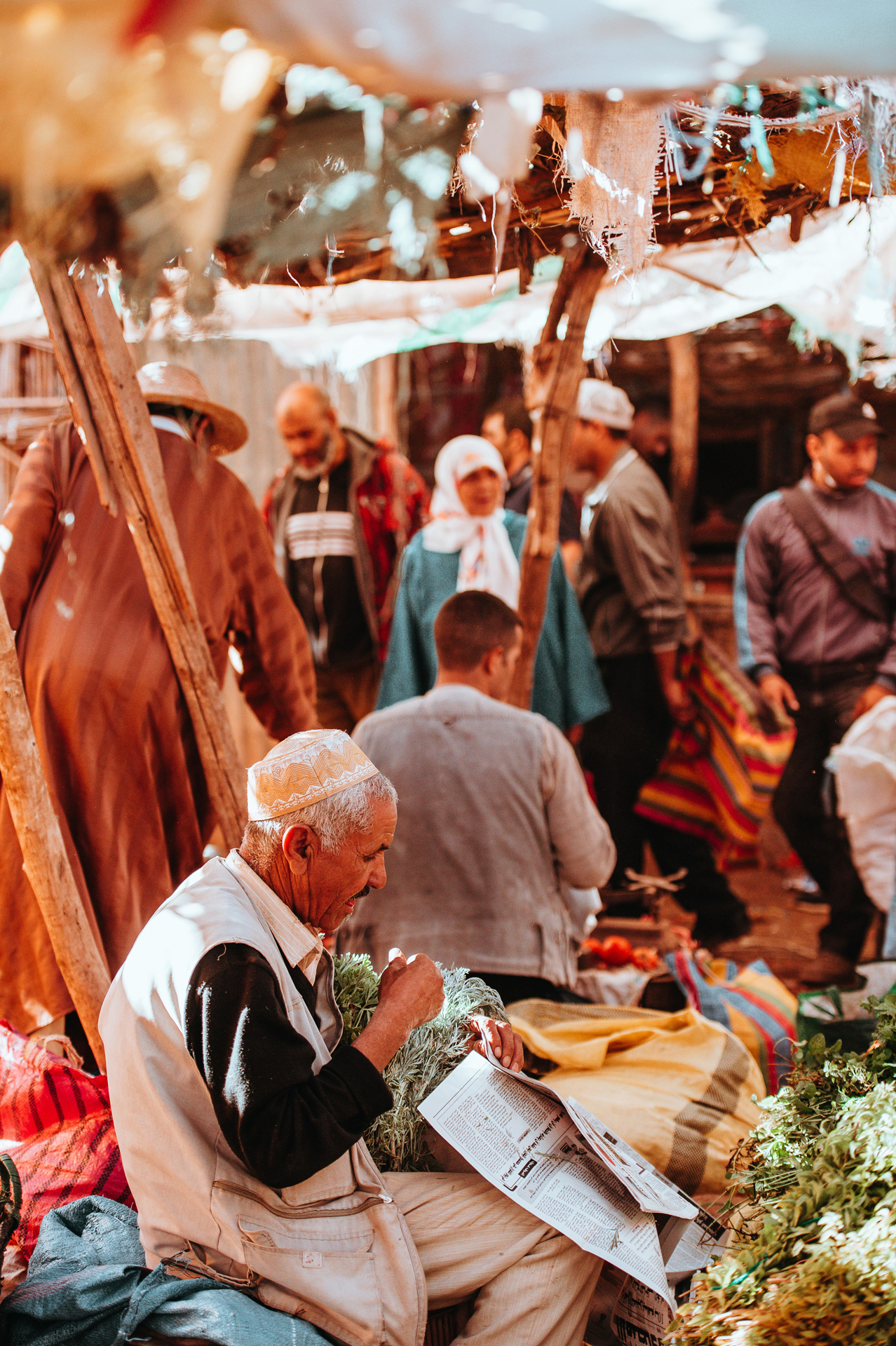 A Moroccan man sat at a market