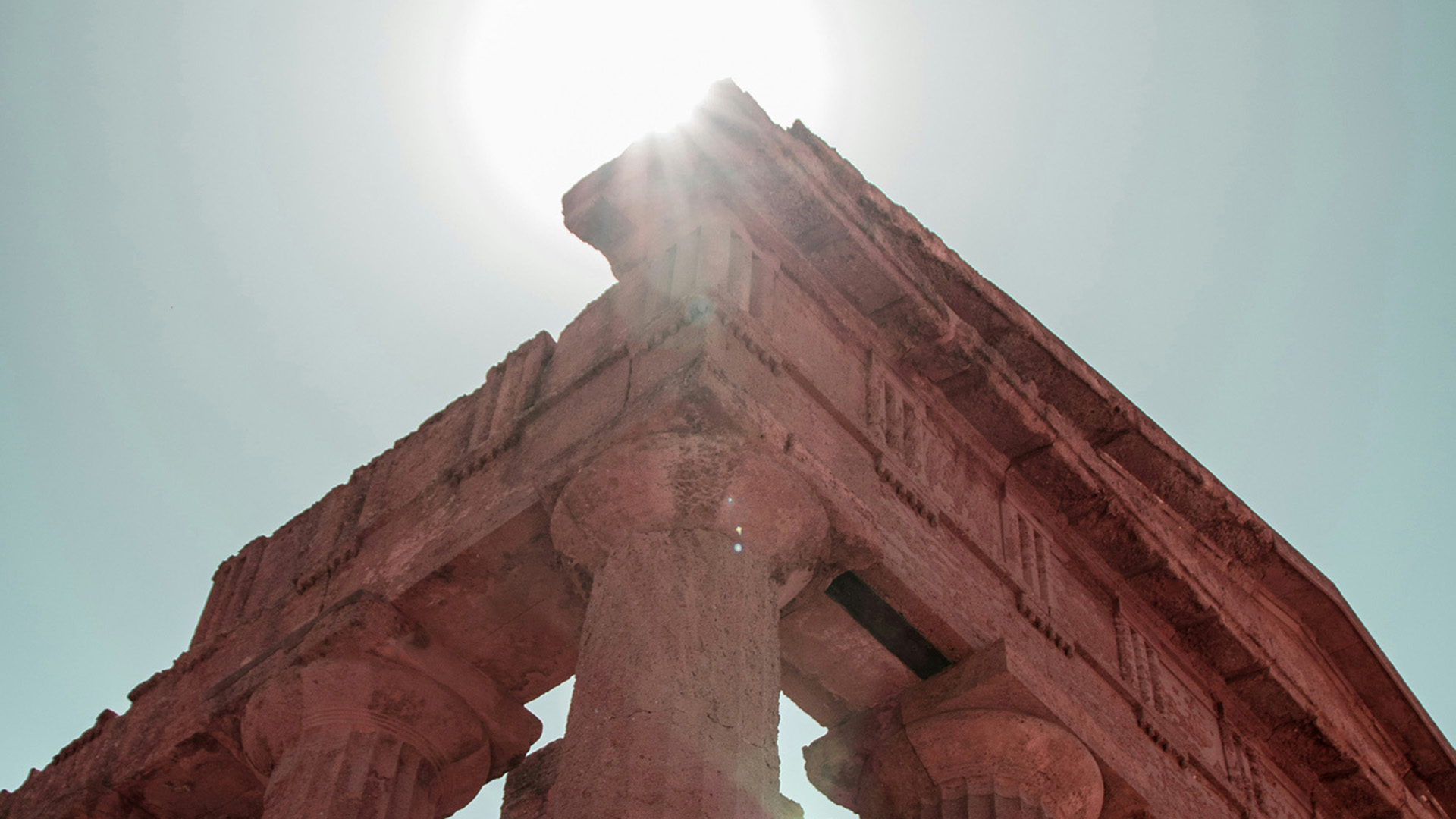Europe, Italy, Sicliy, Agrigento, ancient column architecture taken from below with sunlight shining from above