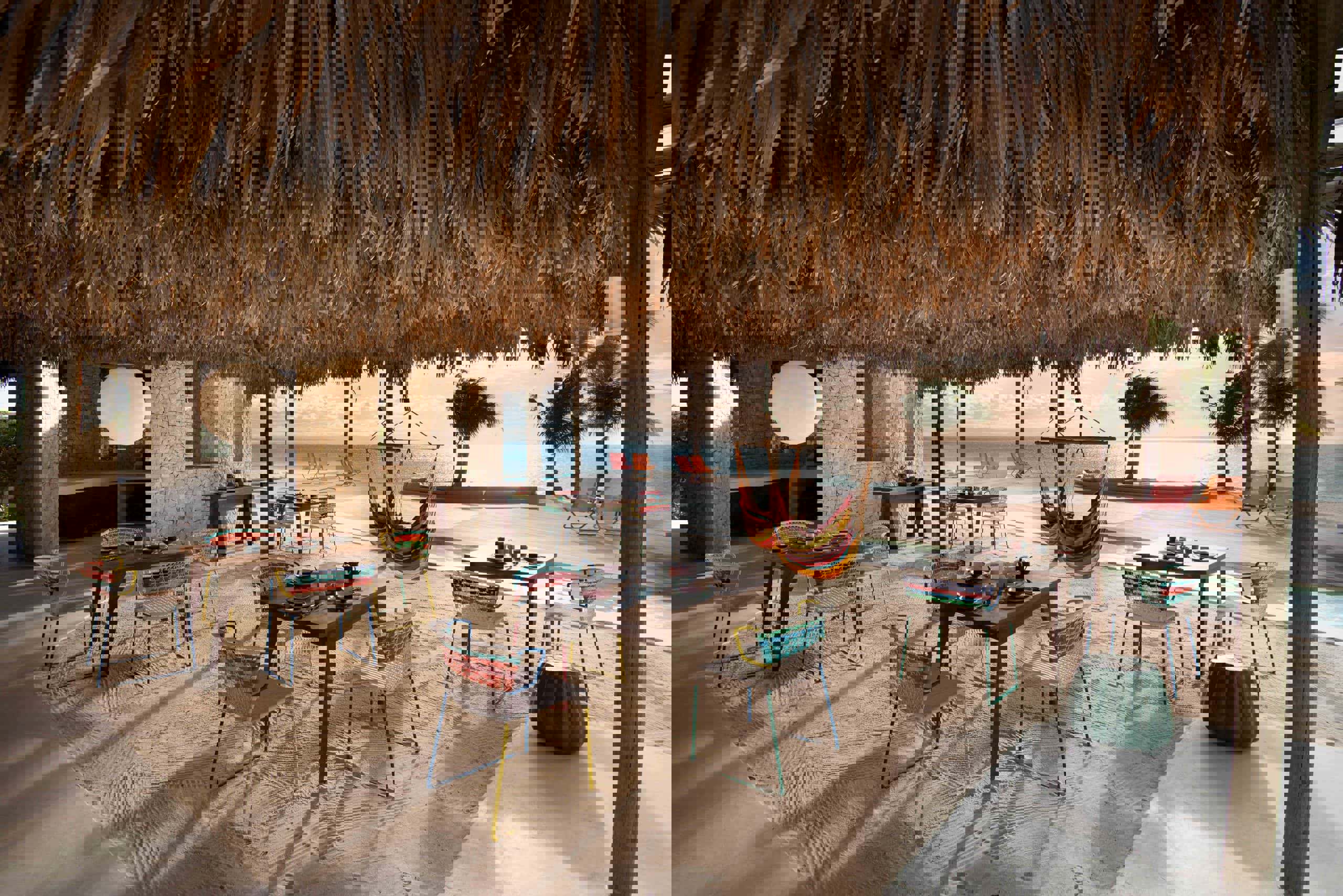 Chair and hammocks of Miavana piazza set up for a meal
