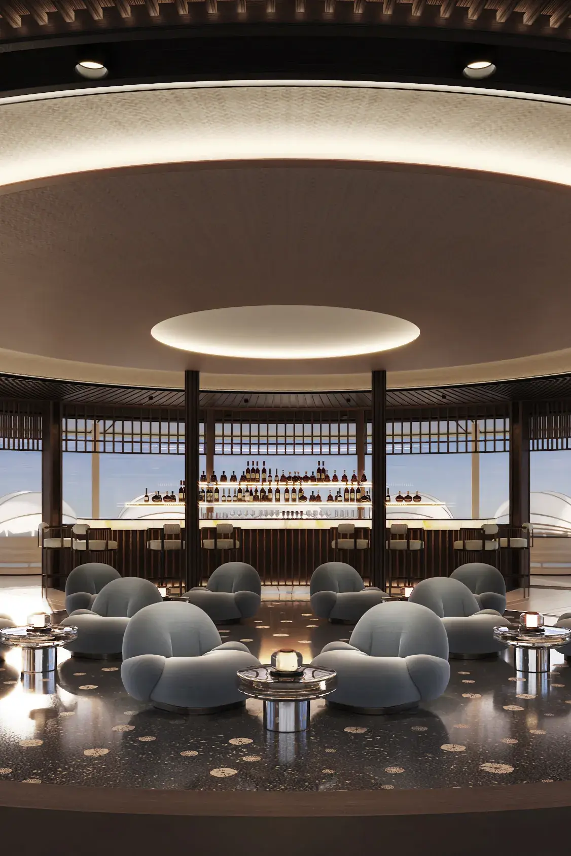 Moody Jazz Club bar aboard Amangati featuring a well stocked bar area and pillowy seats beneath a large intergrated circular ceiling light