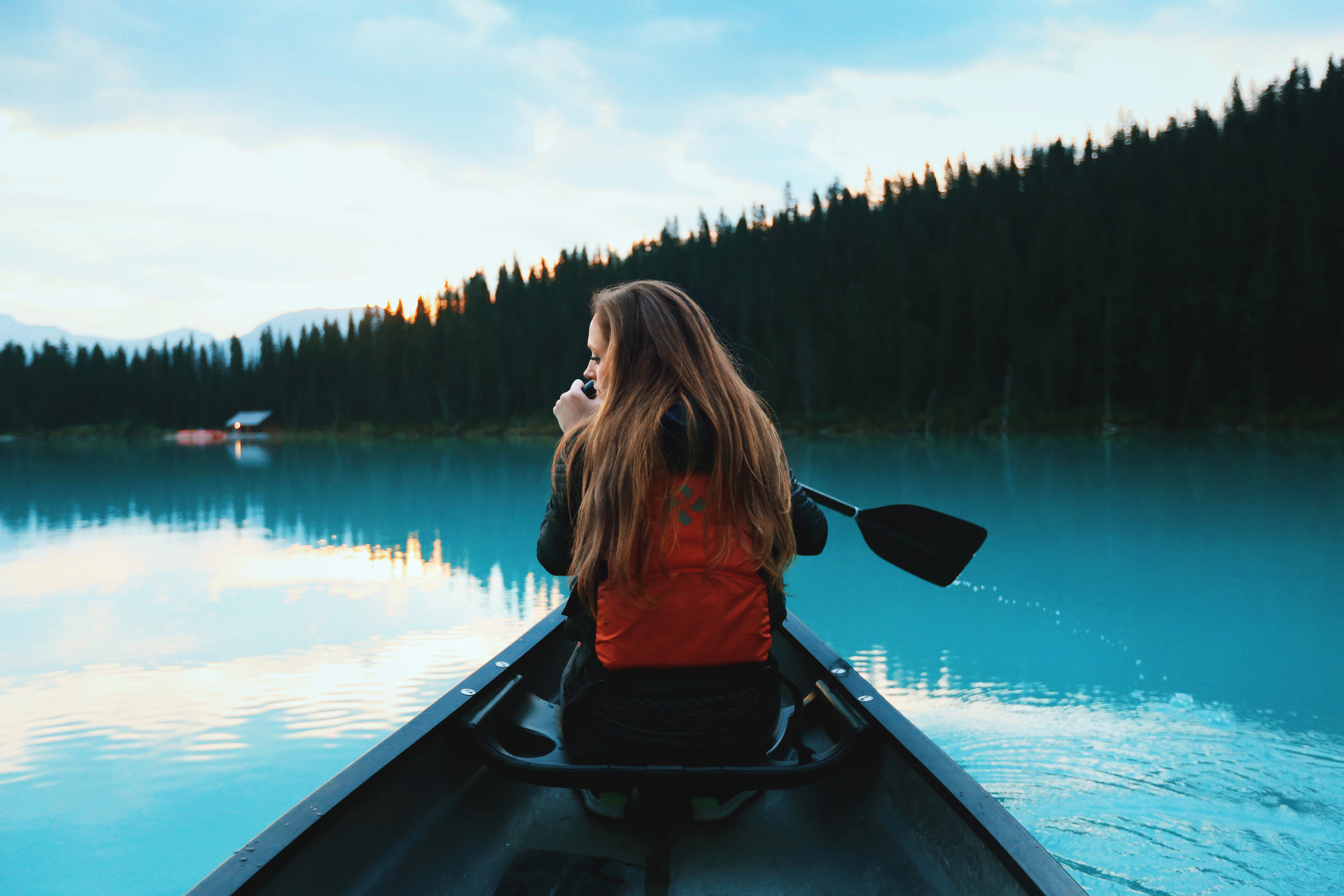 A blonde haired woman on a rowing boat