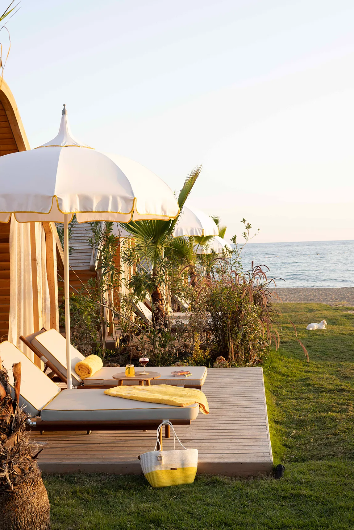 Europe, Turkey, Bijal, Beach Cabana exterior with two chaded sunloungers on a terrace