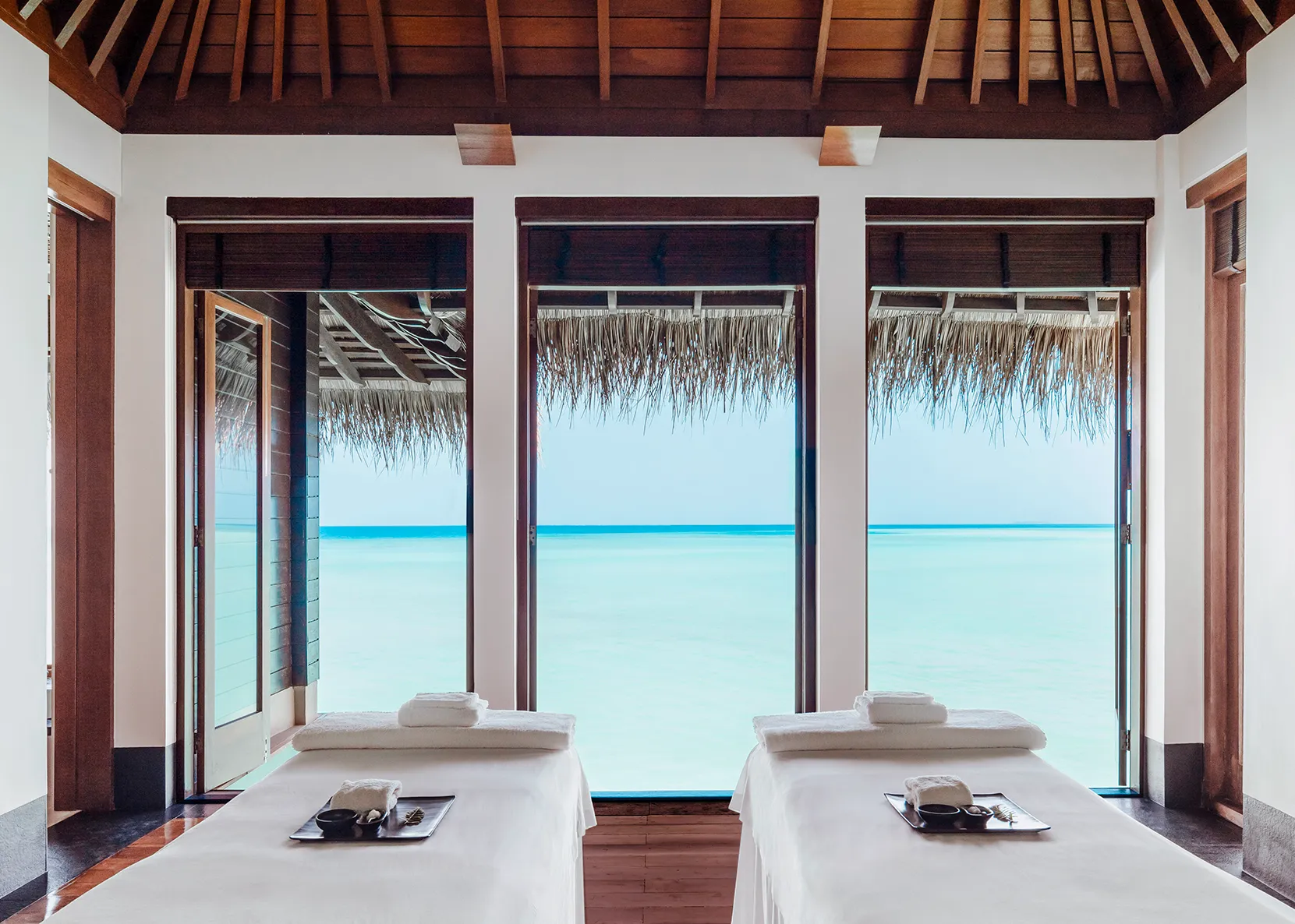 A double treatment room with a sea view at One&Only Reethi Rah, Maldives