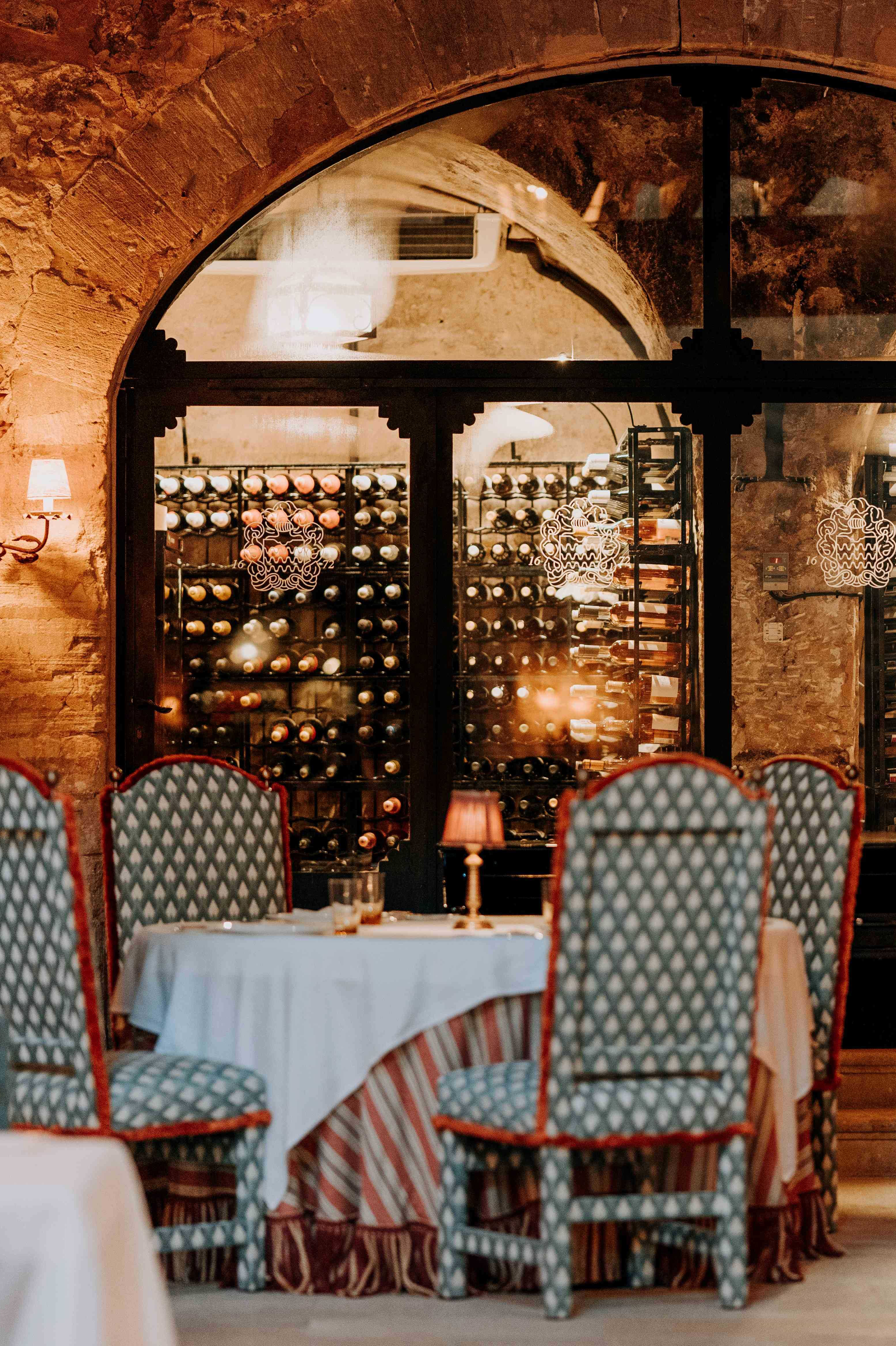 Table and wine vault in main restaurant in Son Net