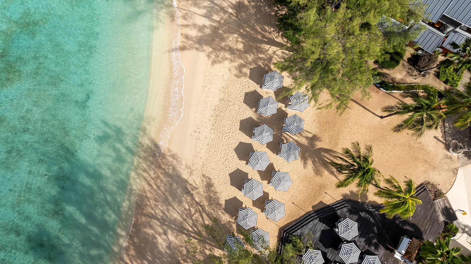 Caribbean, Barbados, Colony Club, aerial view of parasols on the beach