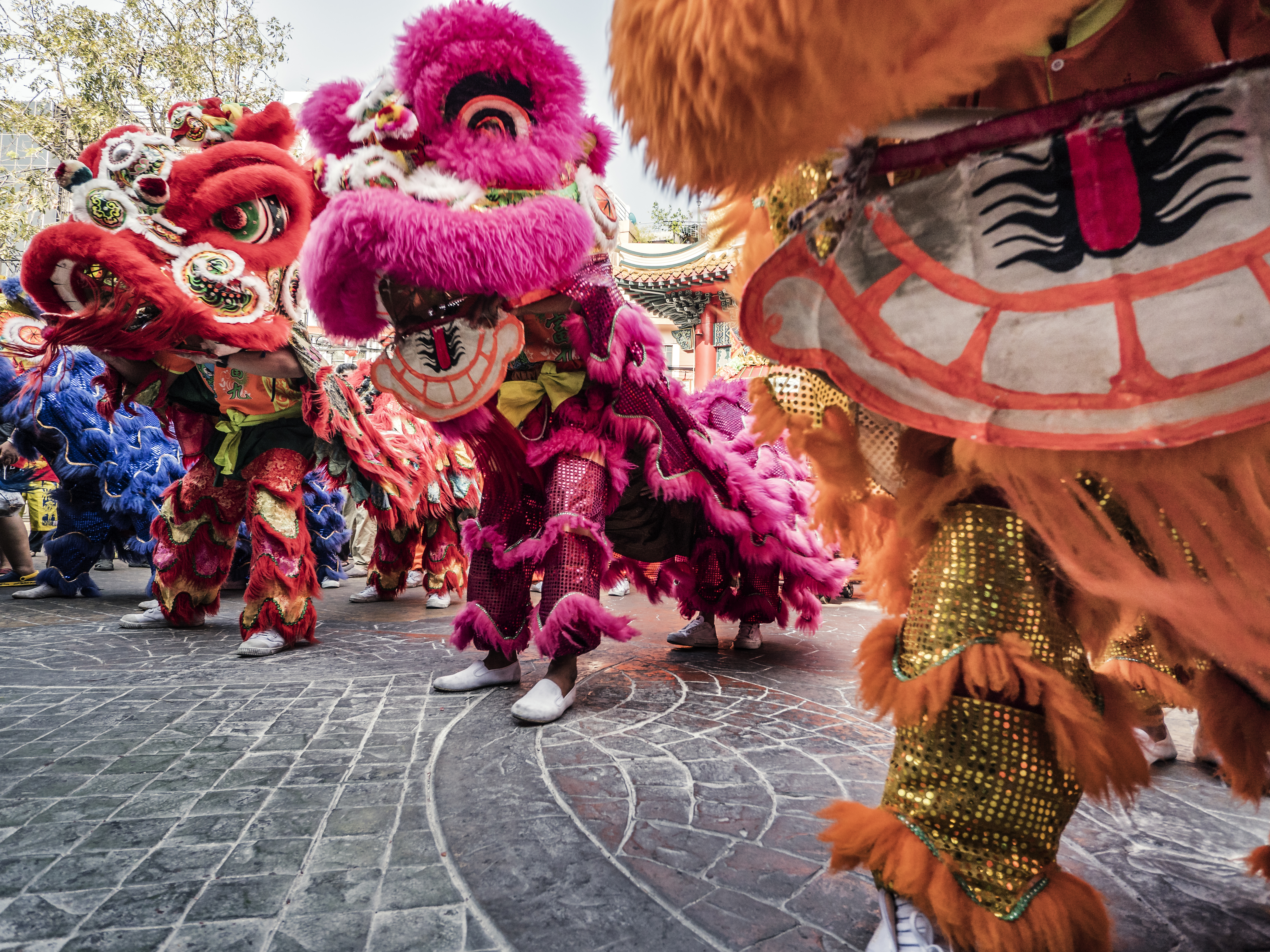 Carnival mascots wearing colourful clothing