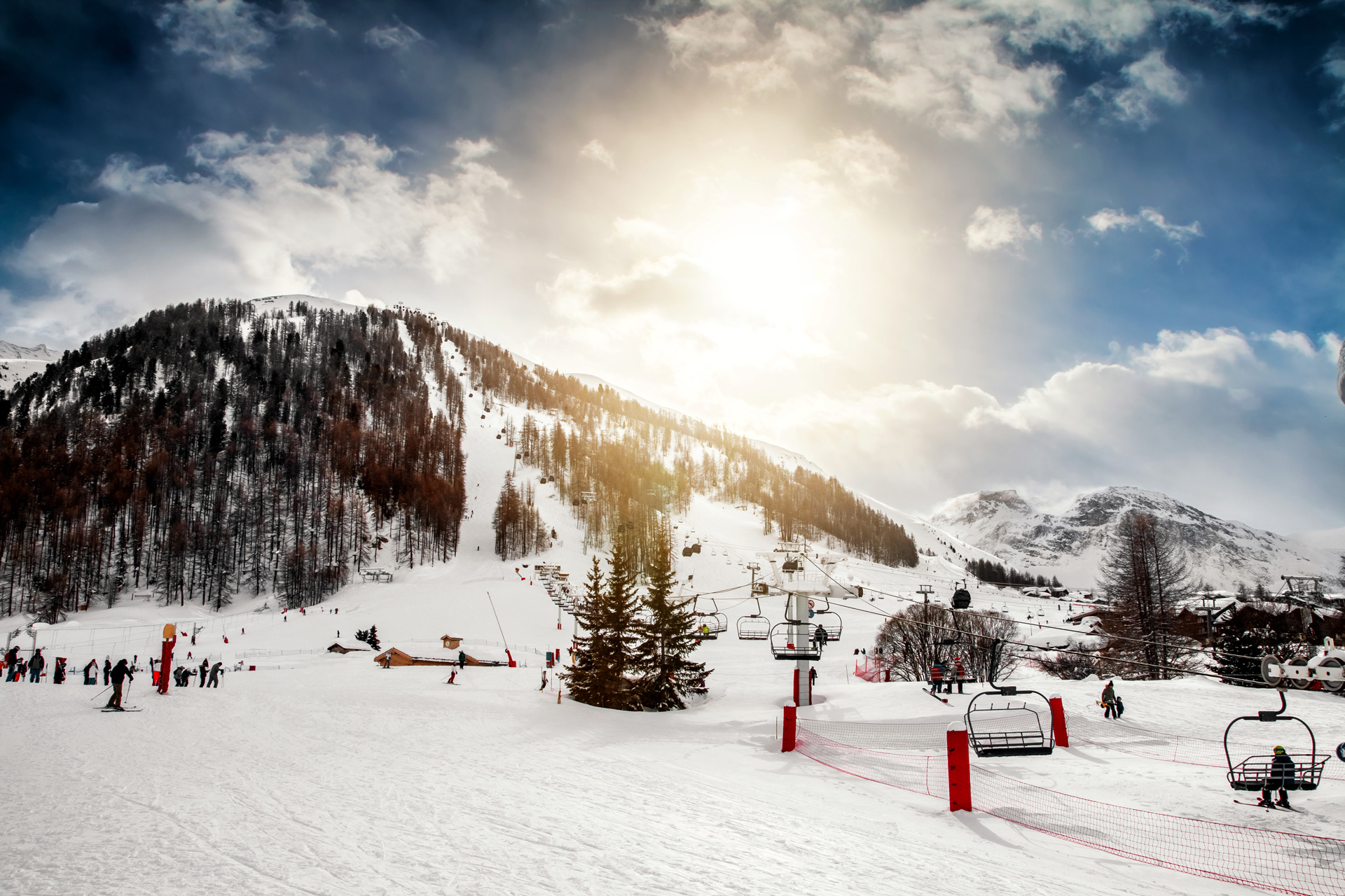 People skiing and on a ski lift in the french ski resort of Val d'Isere