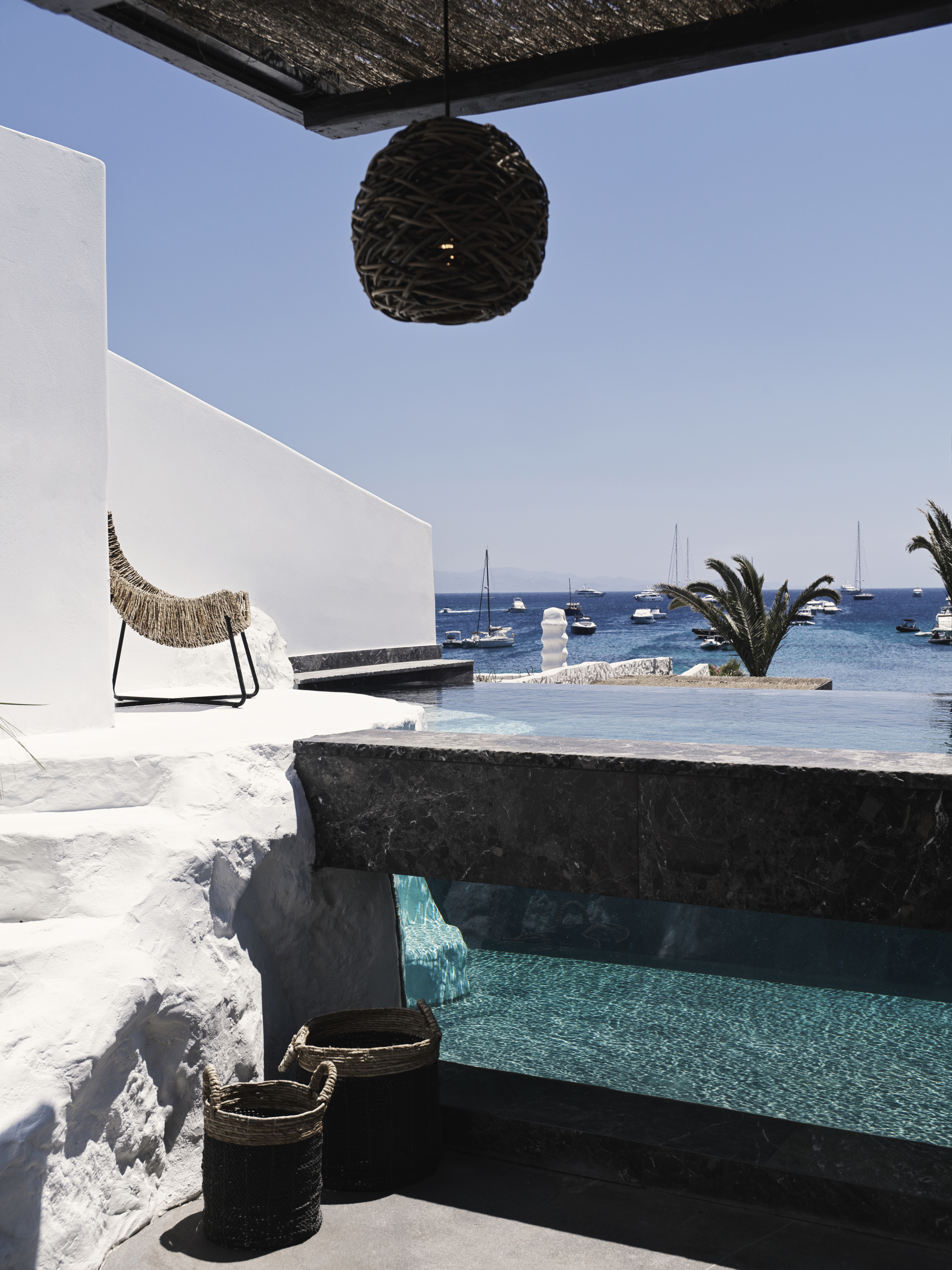 Glass sided pool and seating are on the terrace of the O! Suite at Myconian O